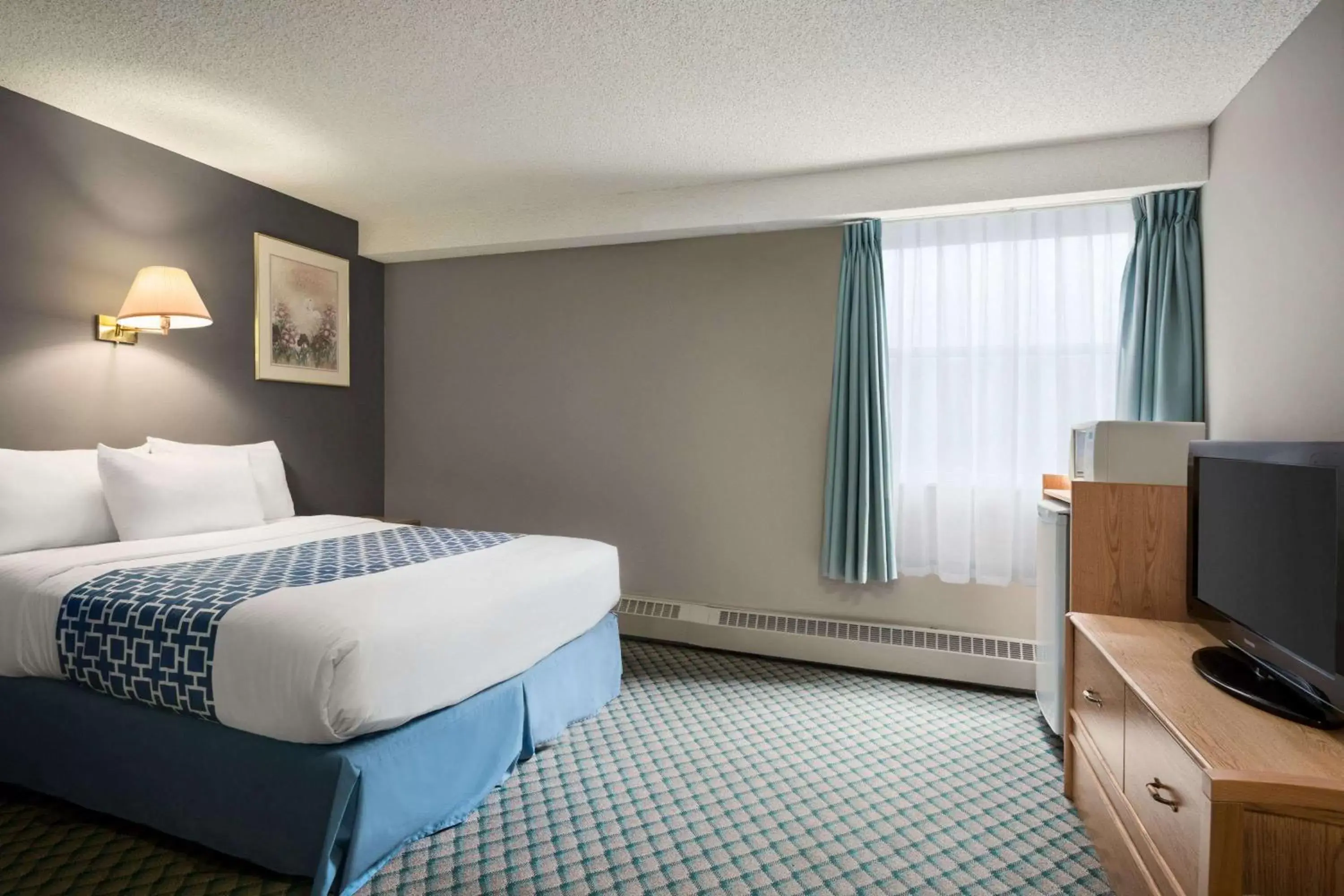 Photo of the whole room, Bed in Travelodge by Wyndham Edmonton Airport
