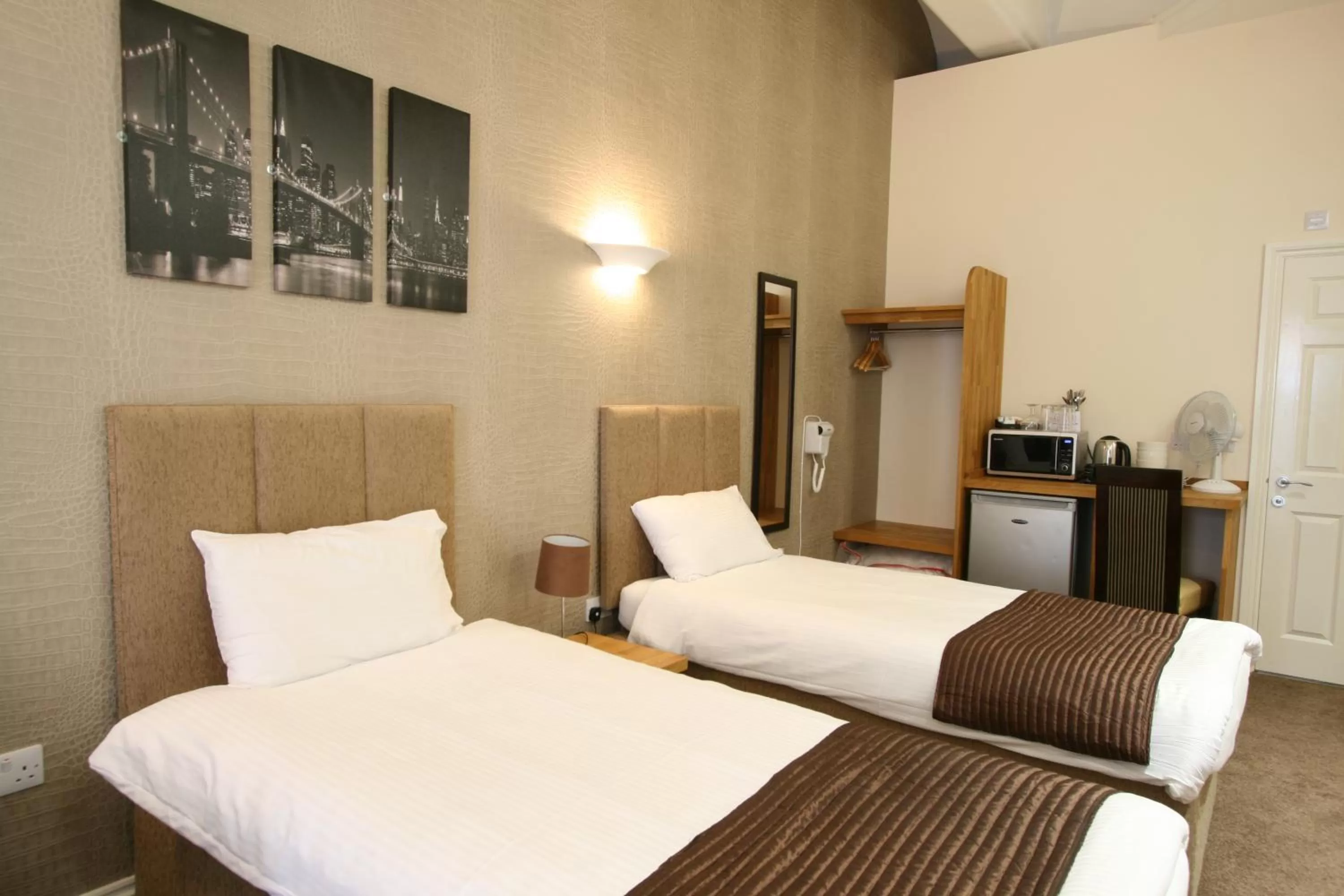 Bed in New County Hotel & Serviced Apartments by RoomsBooked