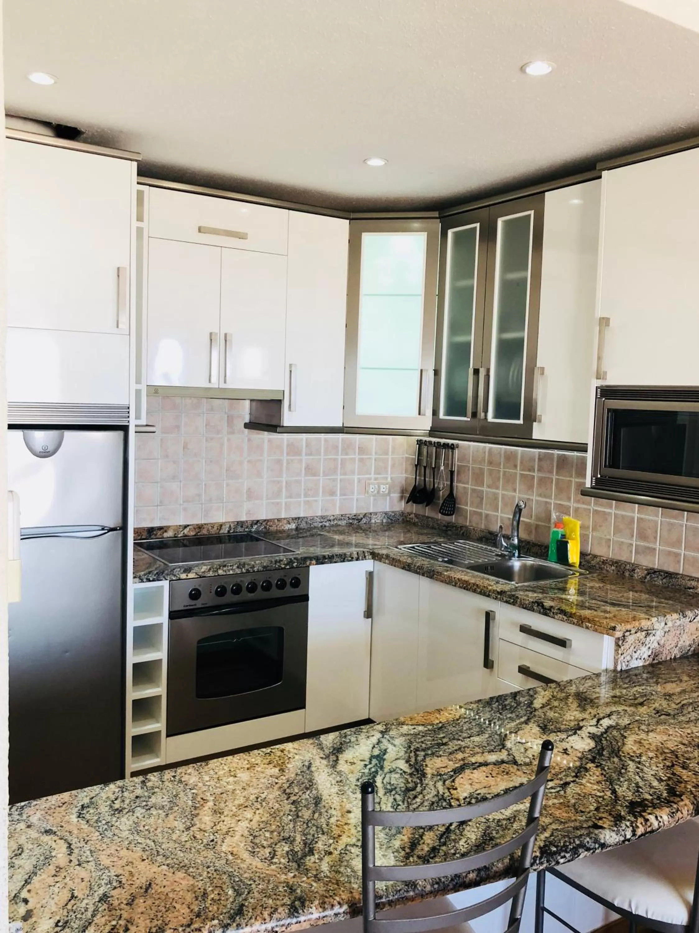 Kitchen or kitchenette in Regency Torviscas Apartments and Suites