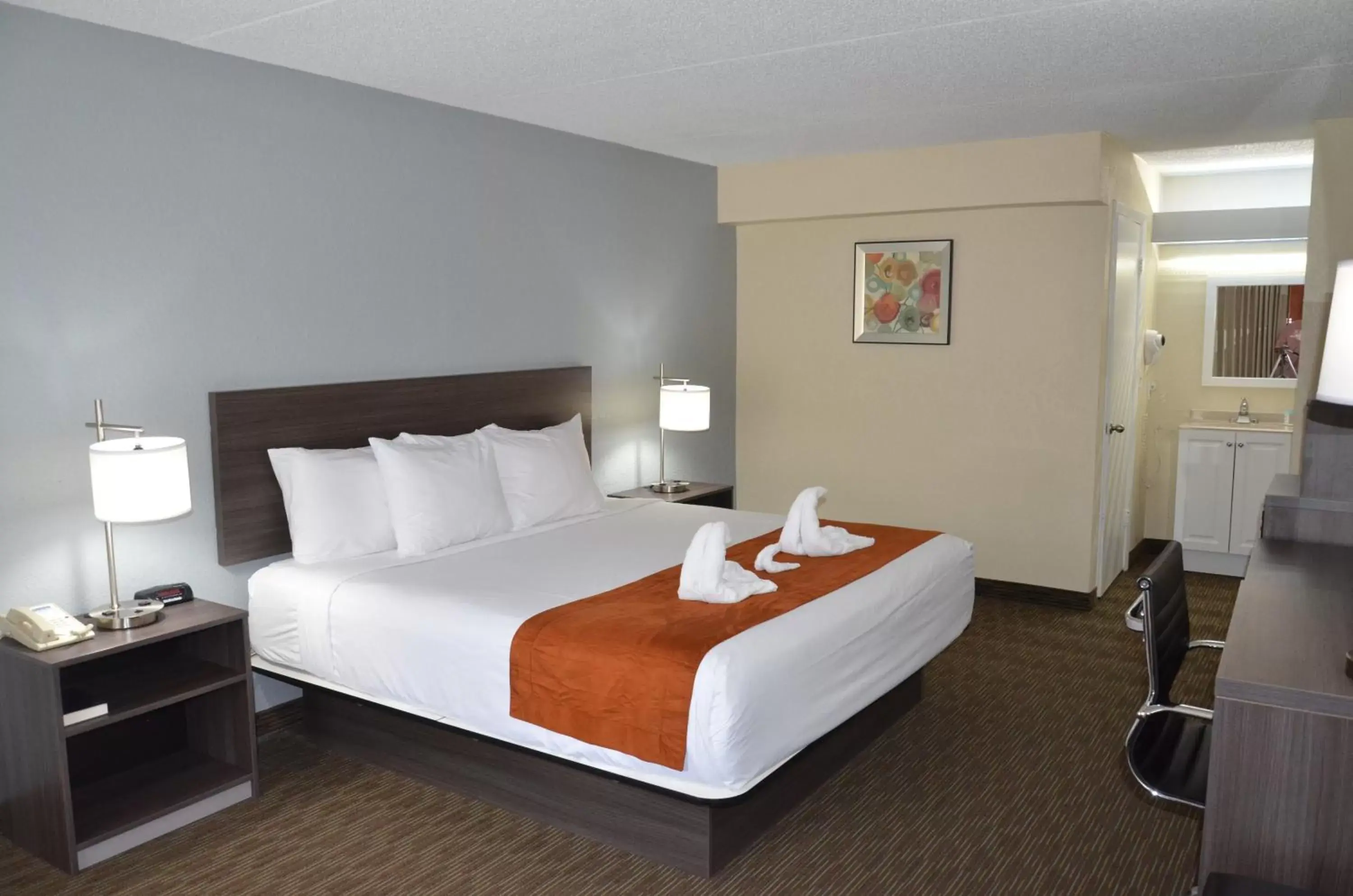 Photo of the whole room, Bed in Days Inn & Suites by Wyndham Orlando Airport