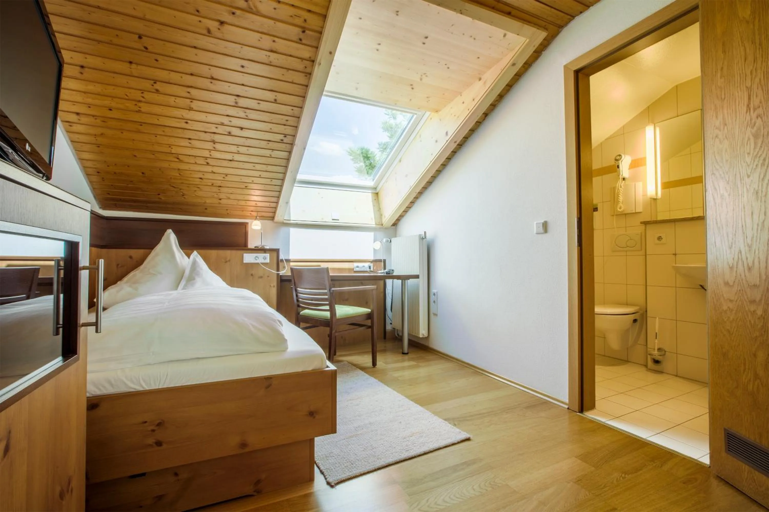 Bathroom, Bed in Hotel Brunner