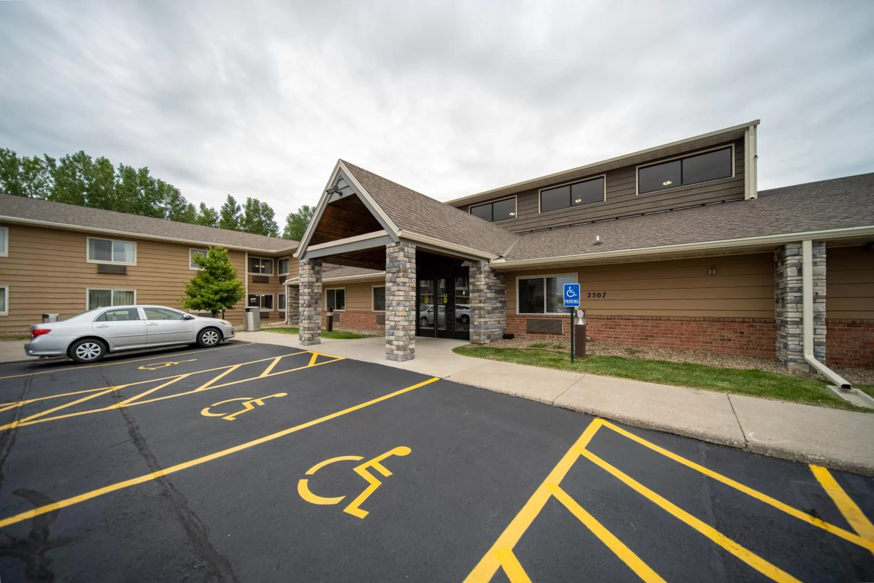 Property building in AmericInn by Wyndham Ames