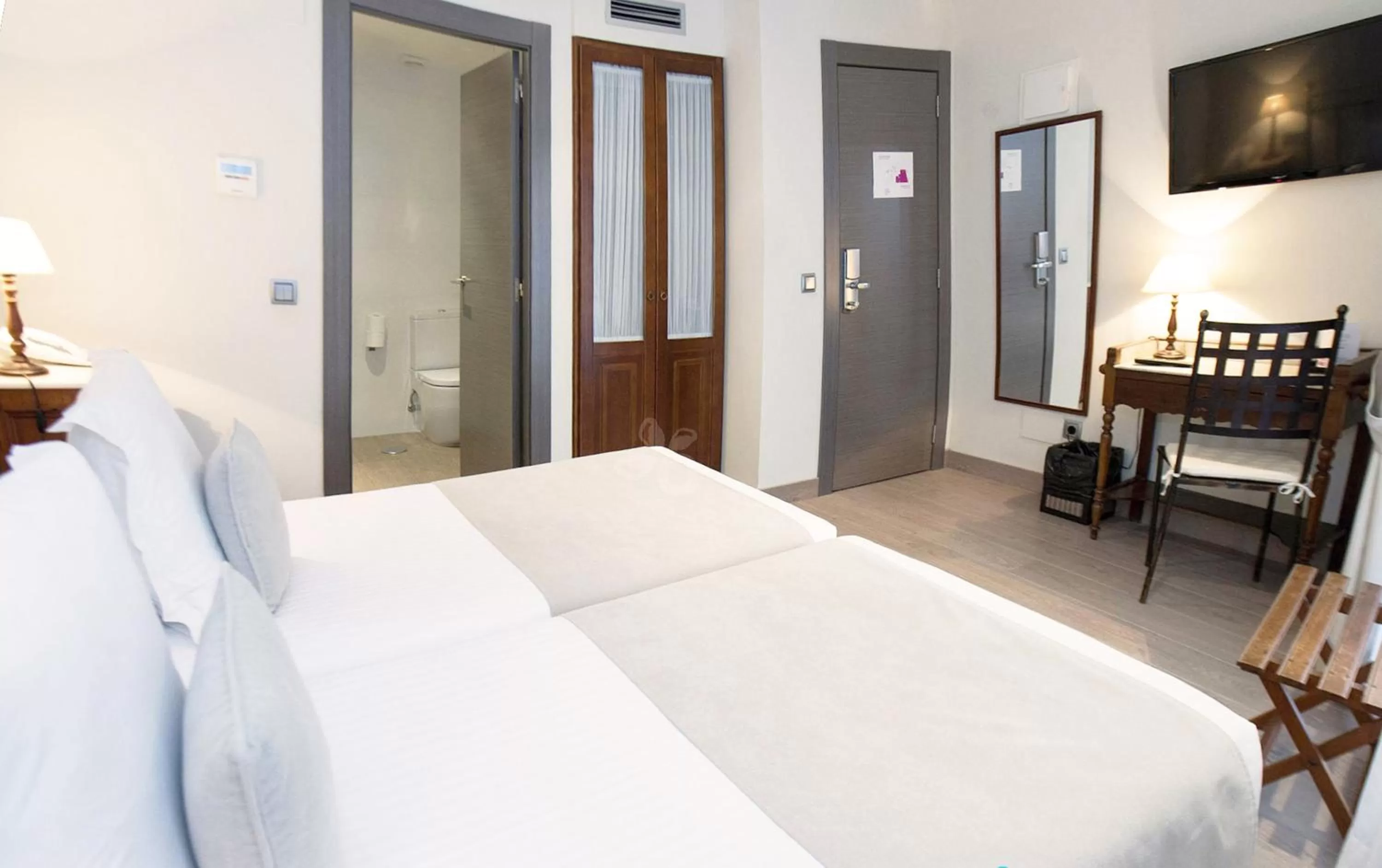 Bed in Le Petit Boutique Hotel