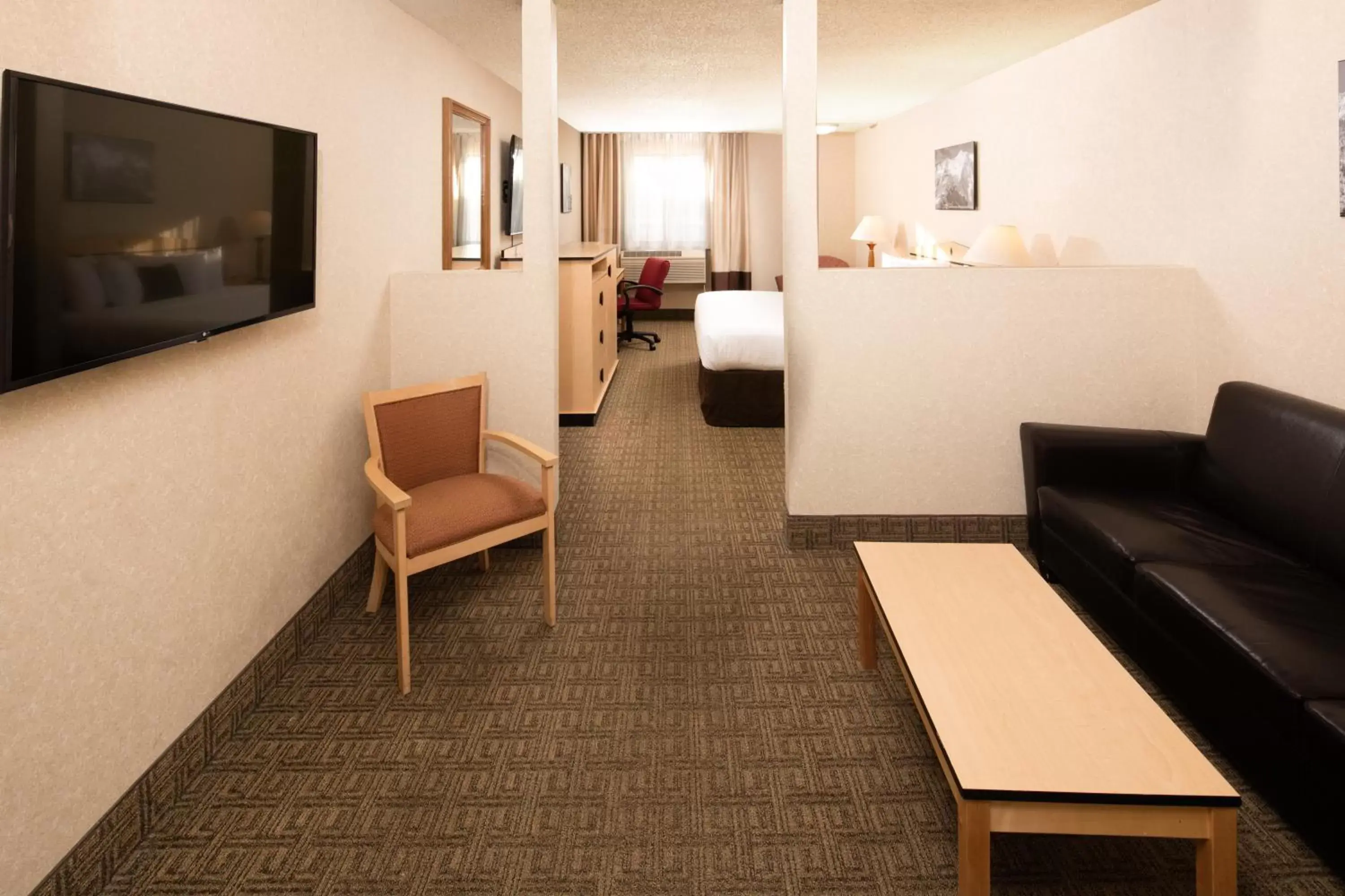 Bed, Seating Area in SYLO Hotel Denver Airport, a Ramada by Wyndham