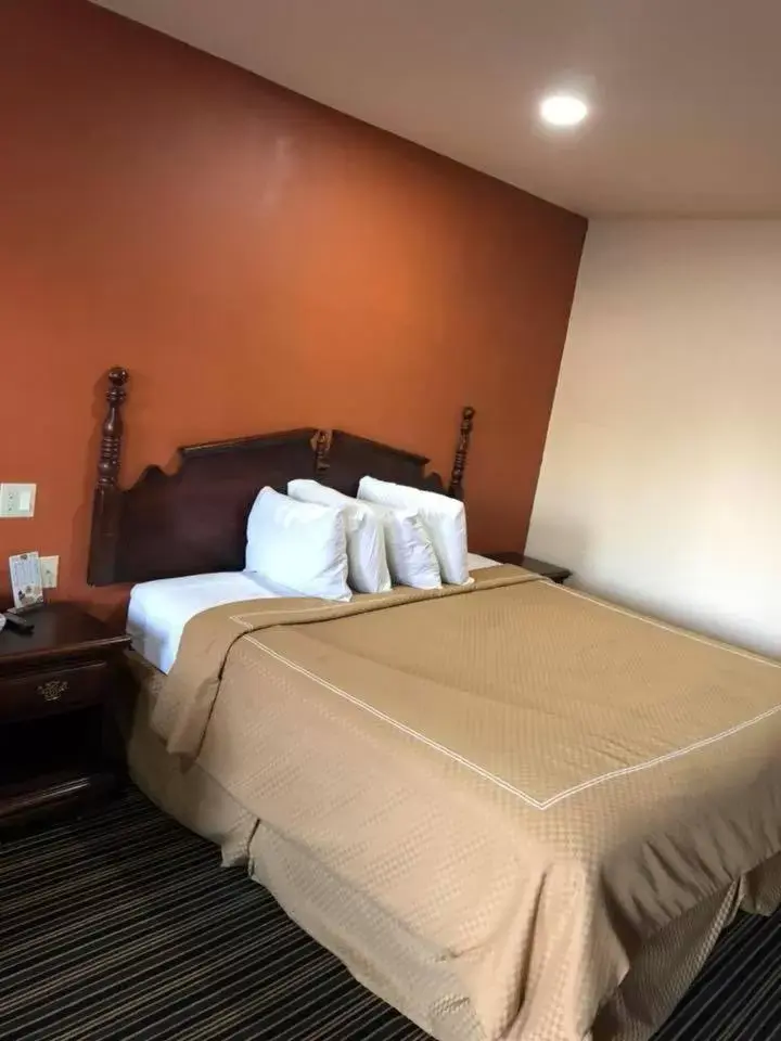 Bed in Scottish Inn and Suites Perry
