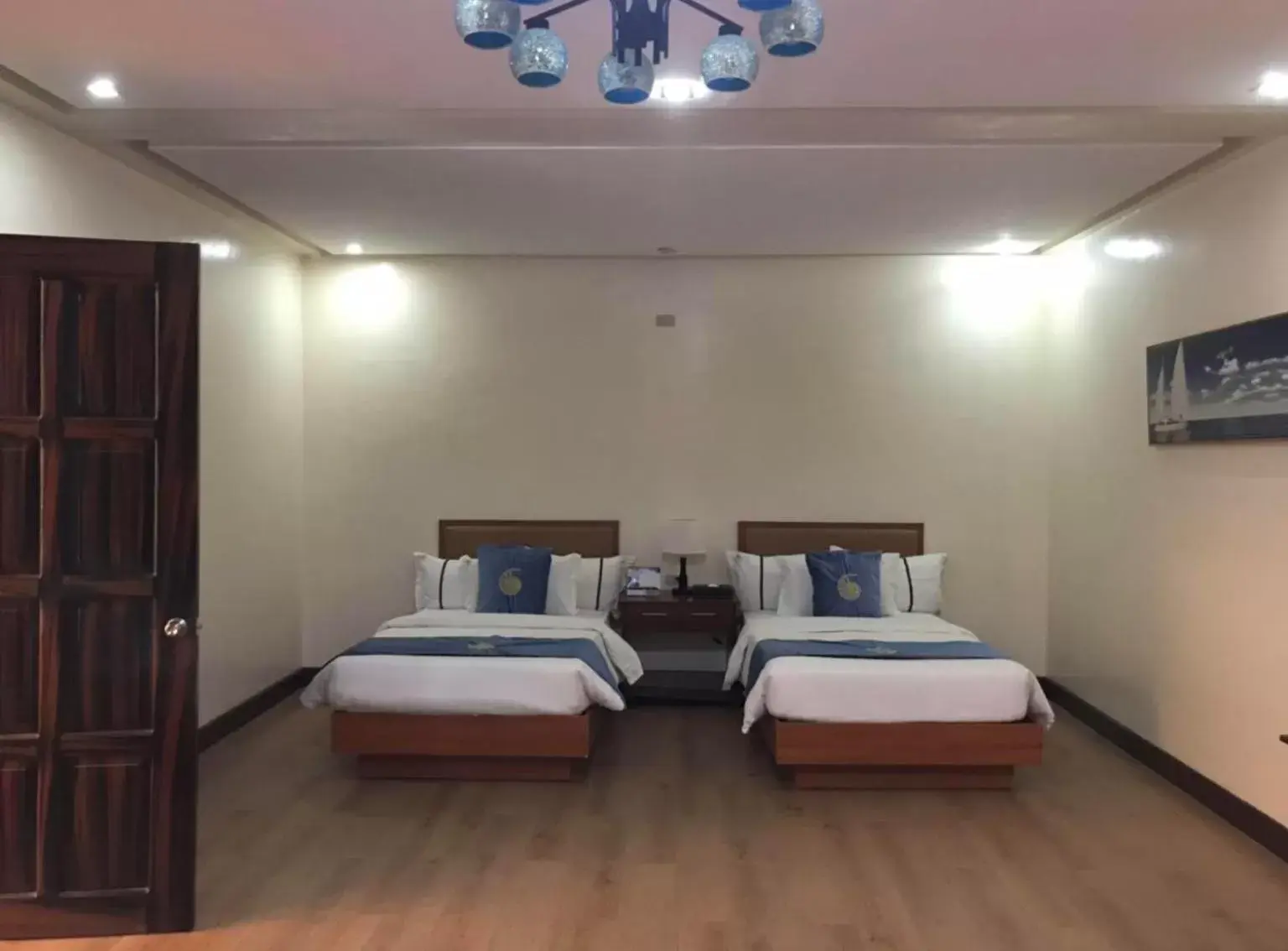 Photo of the whole room, Bed in Costa Palawan Resort