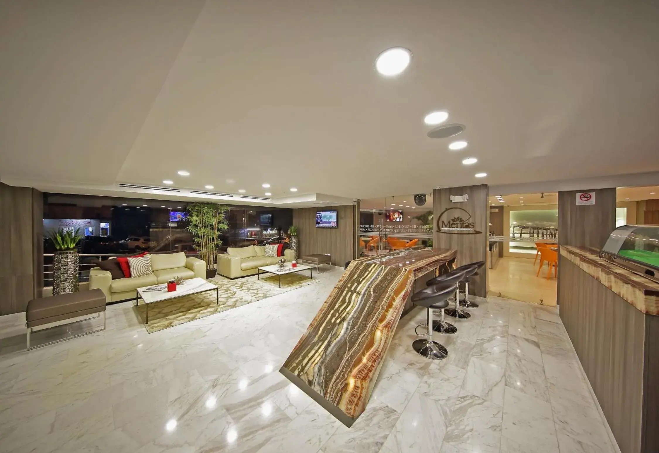 Communal lounge/ TV room, Lobby/Reception in Ramada Panama Centro via Argentina