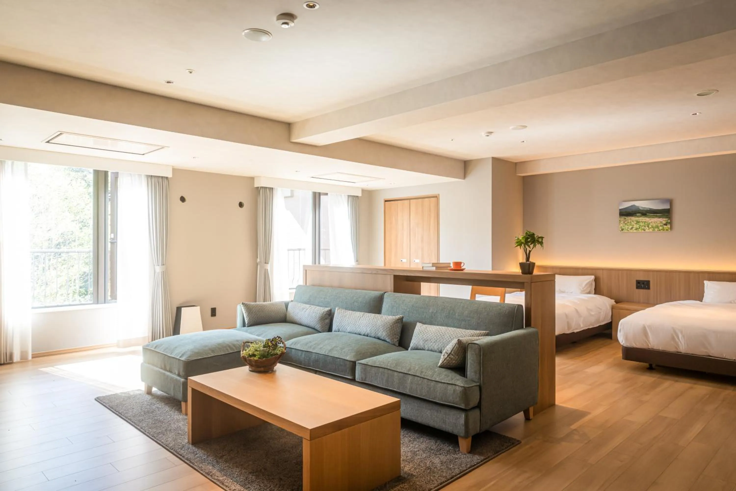 Living room, Bed in Higashikawa Asahidake Onsen Hotel Bear Monte