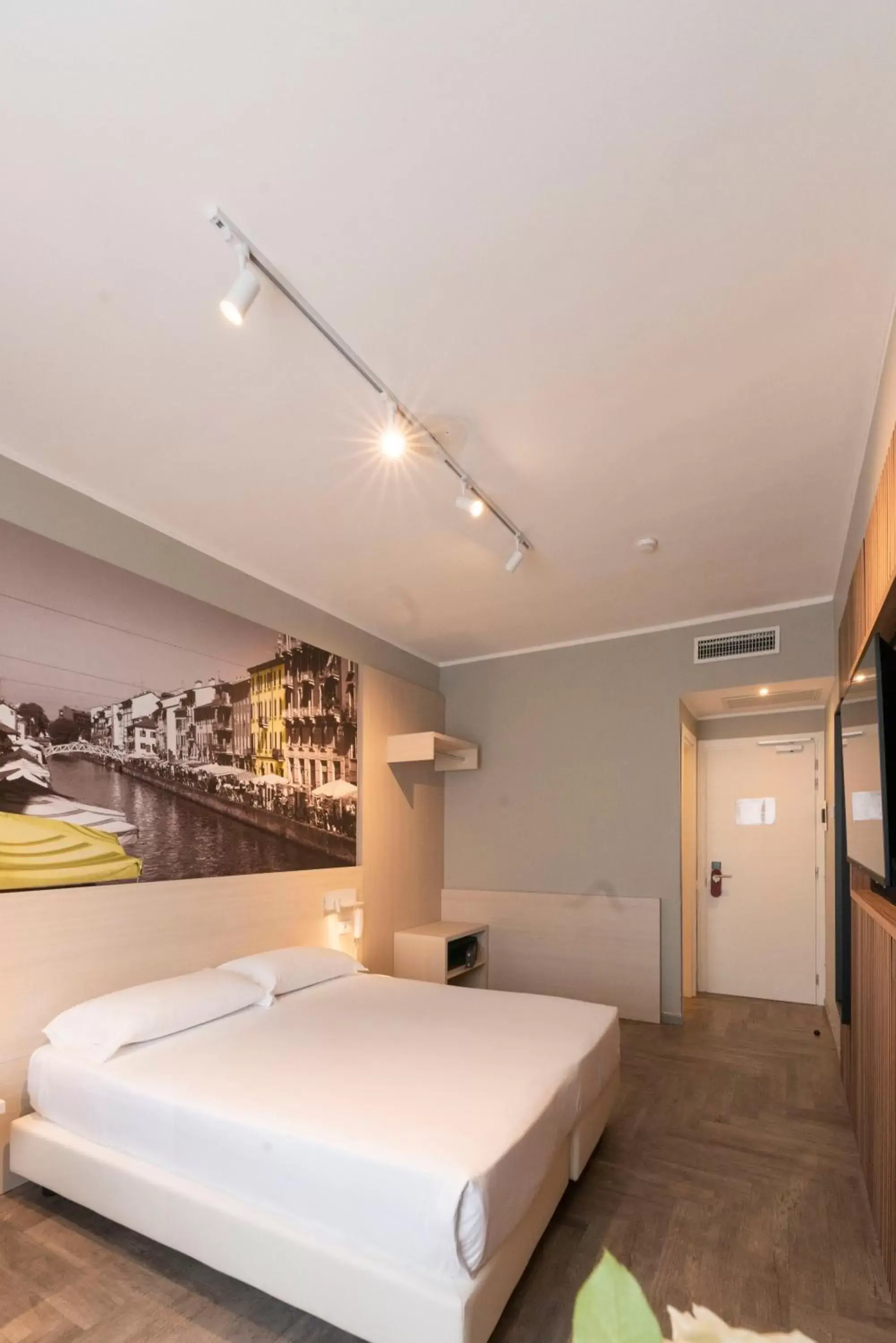Bed in Kleos Hotel Milano