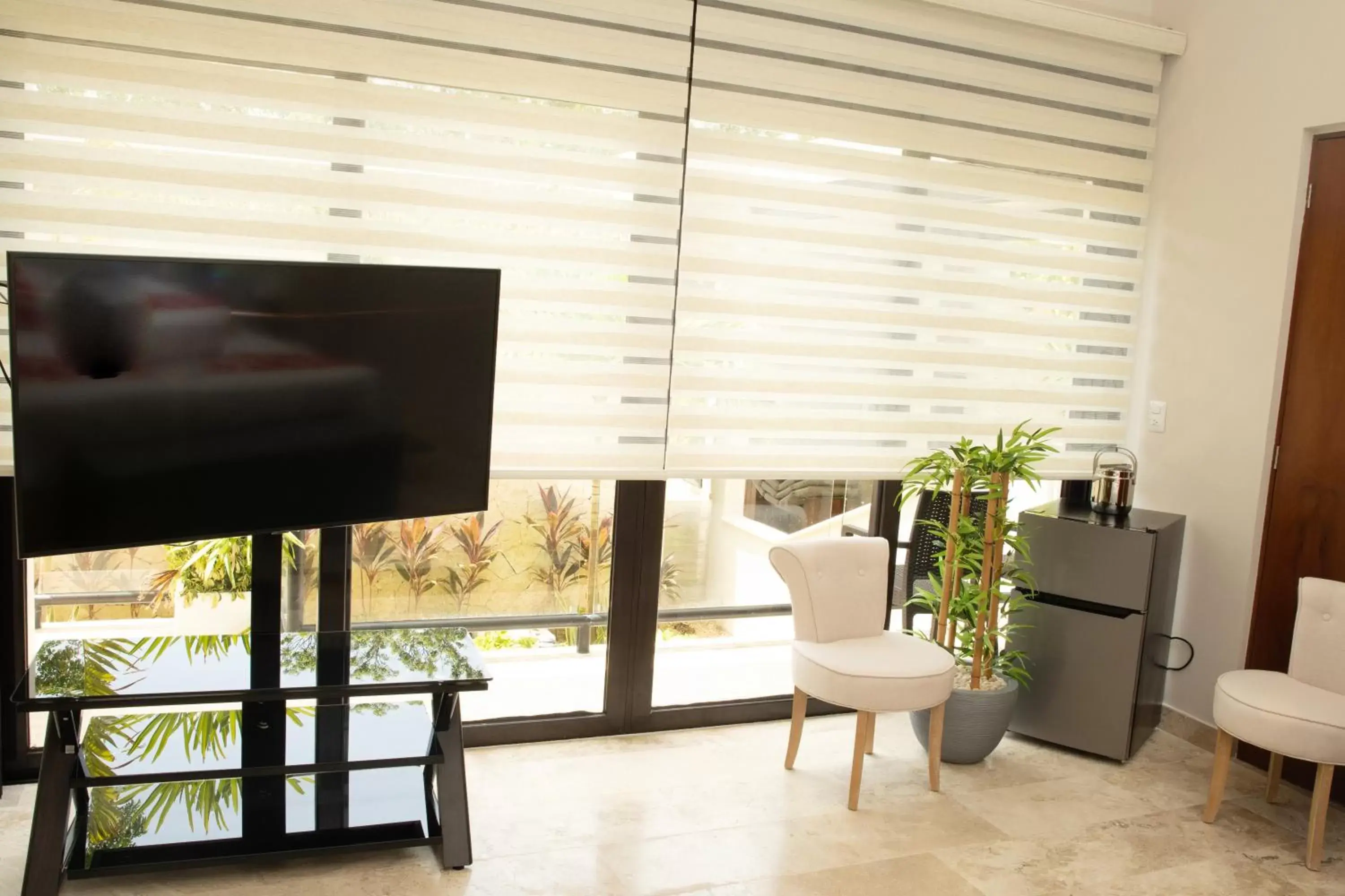 Bedroom, TV/Entertainment Center in Xaha Villas Suites & Golf Resort