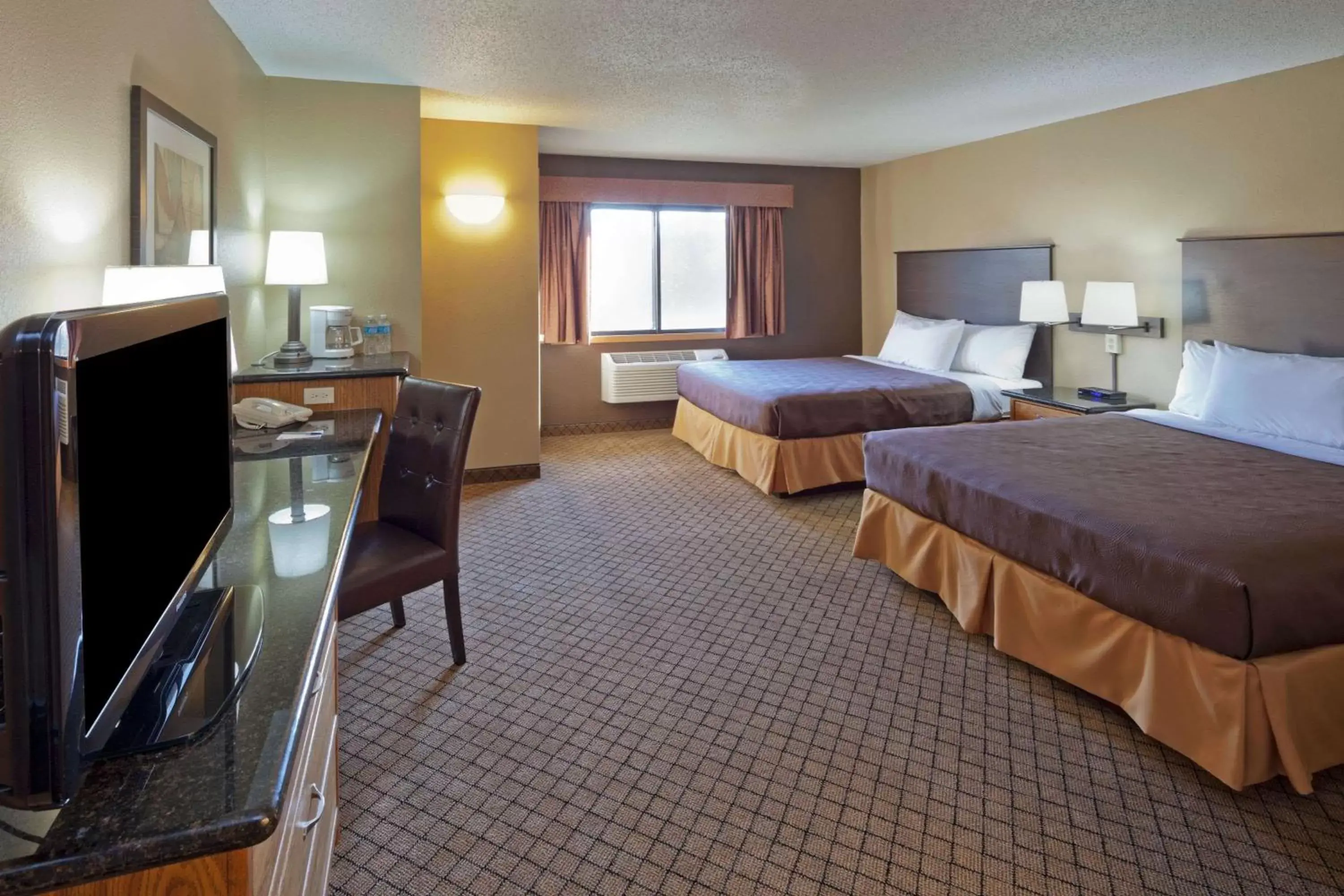 Photo of the whole room, TV/Entertainment Center in AmericInn by Wyndham Hartford WI