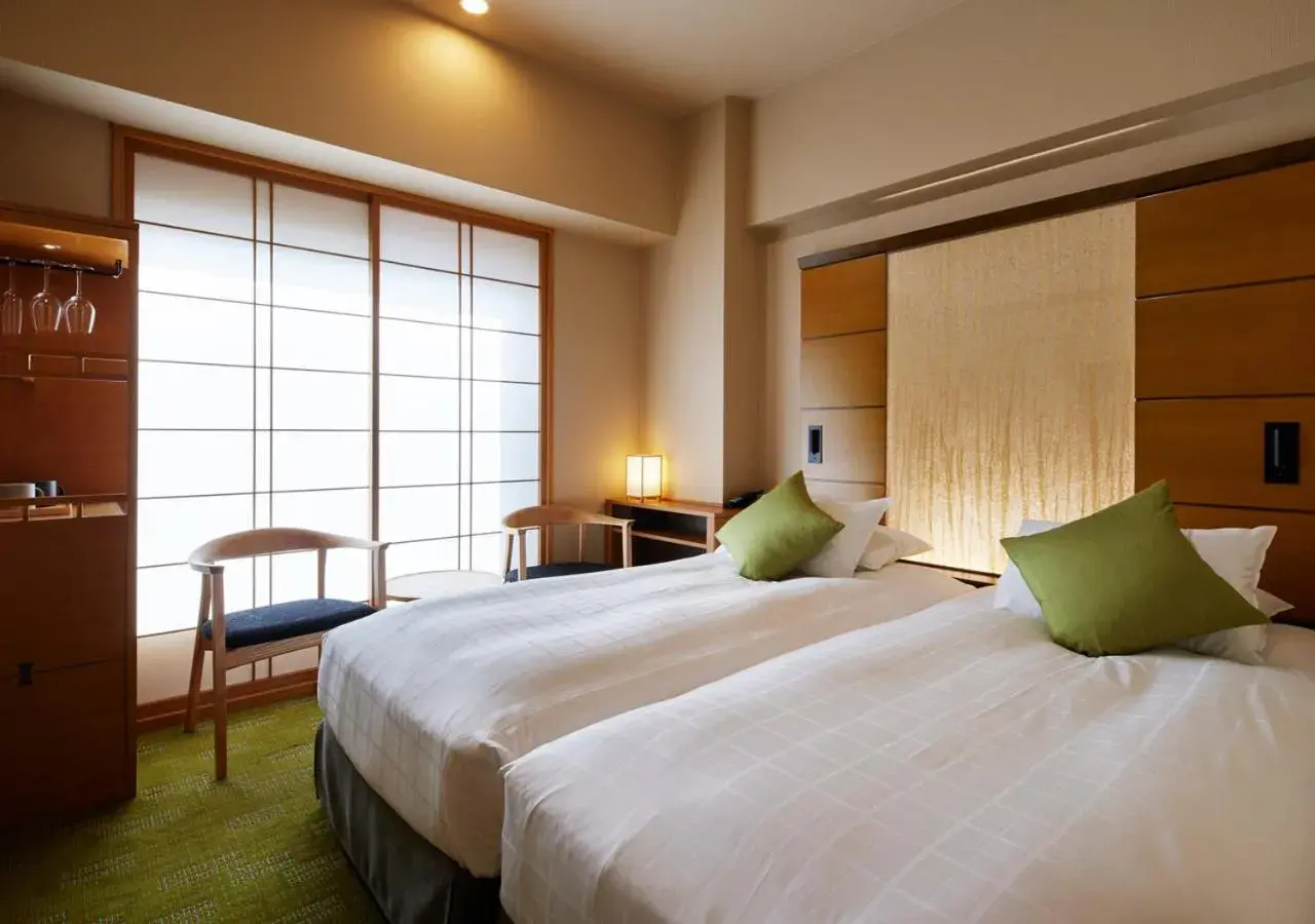 Bed in Hotel Niwa Tokyo