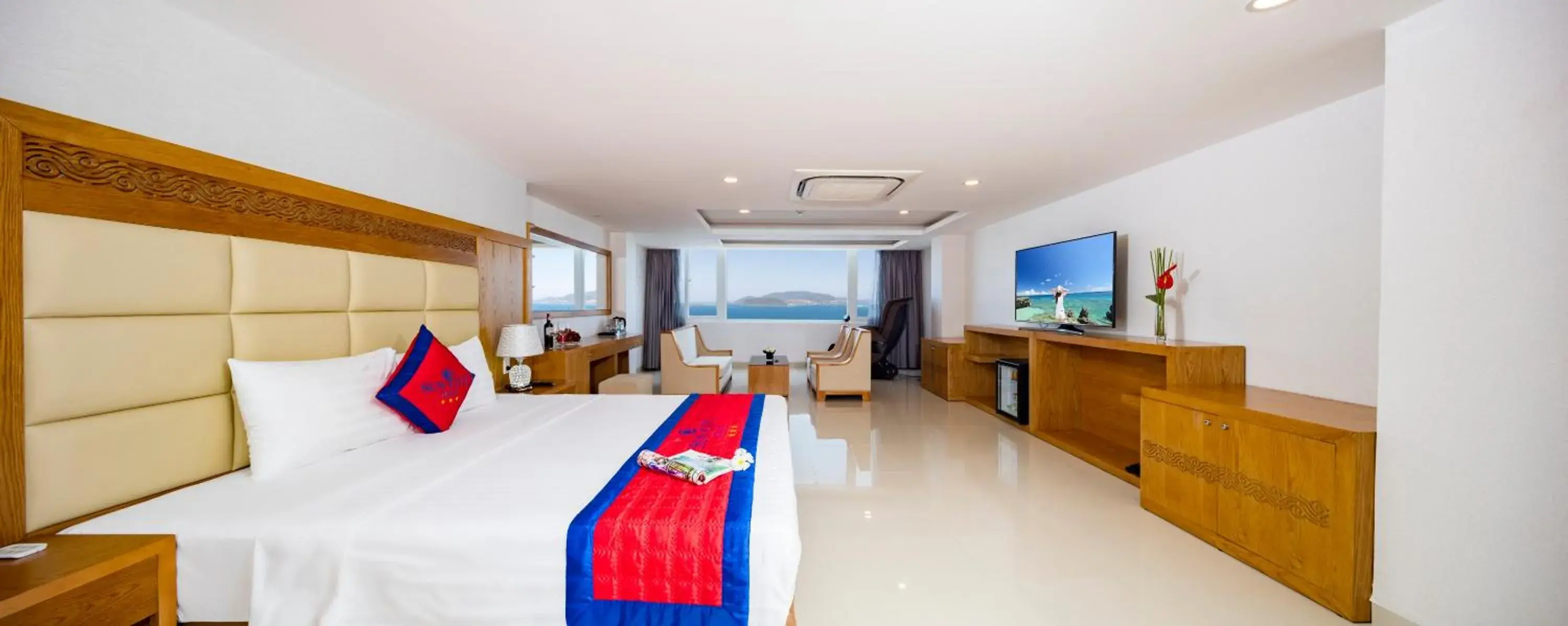 Seating area, Bed in Sun City Hotel Seating area, Bed in Sun City Hotel