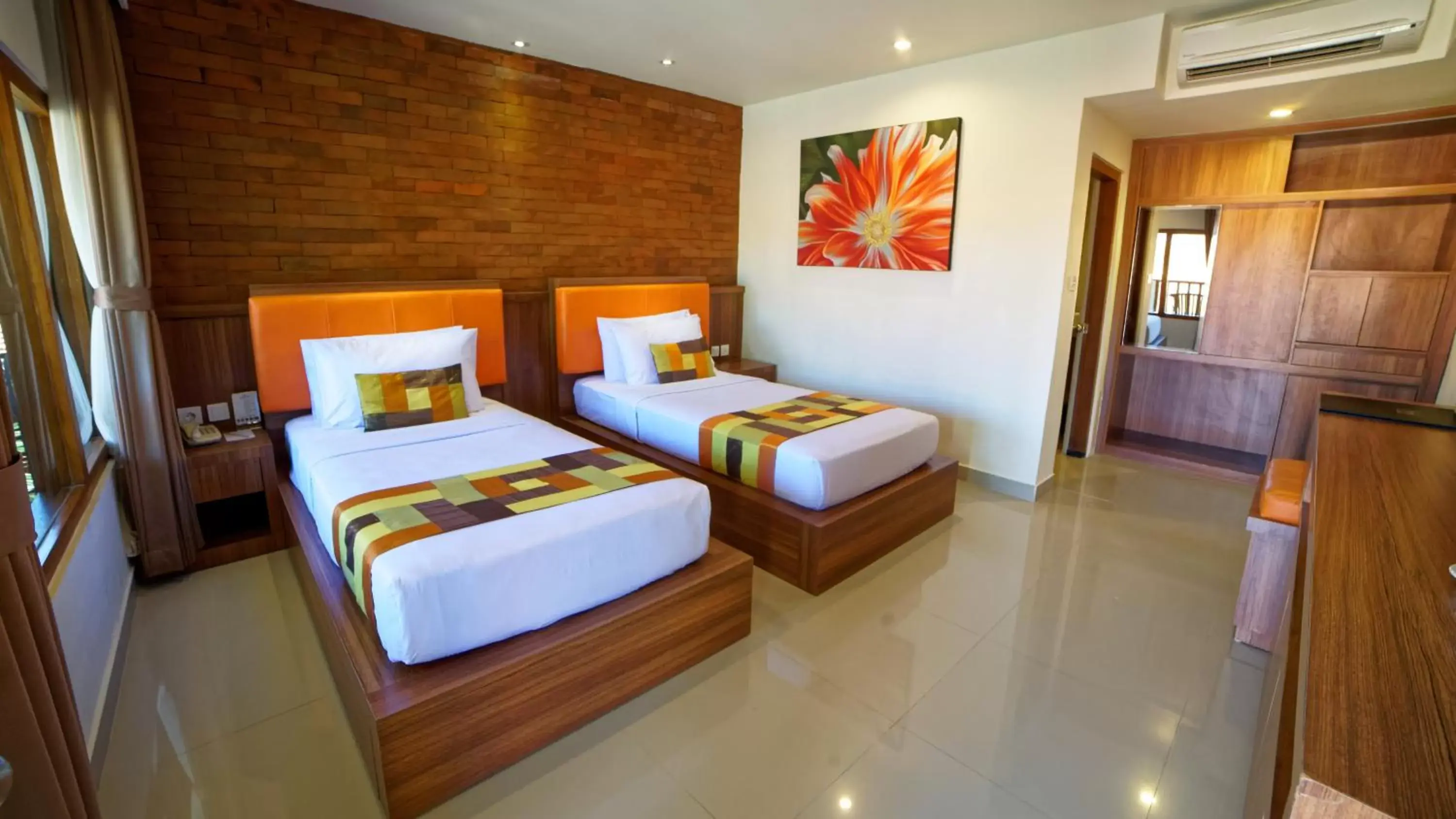 Bed in Wina Holiday Villa Kuta Bali