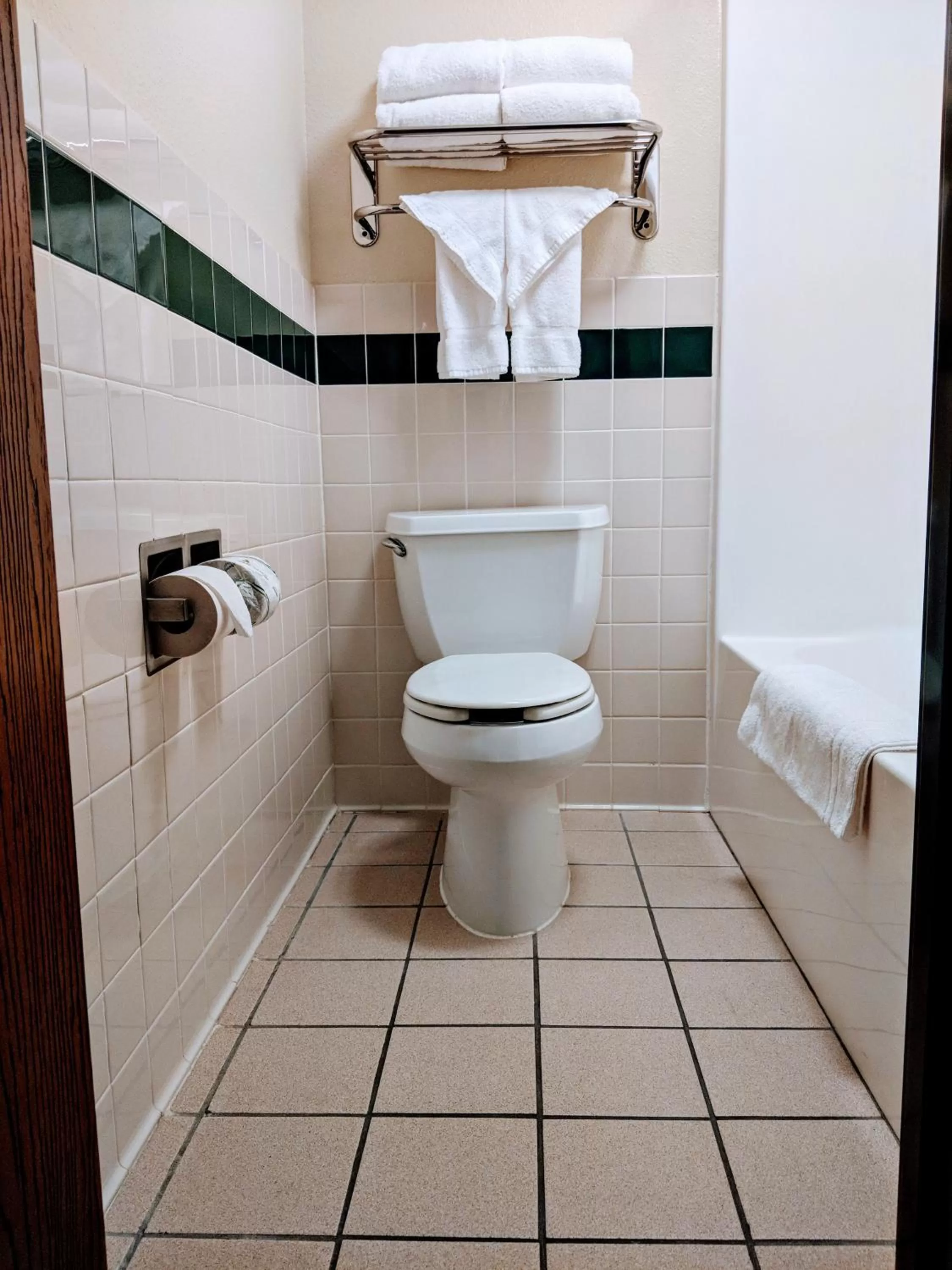 Toilet in AmericInn by Wyndham Grand Forks