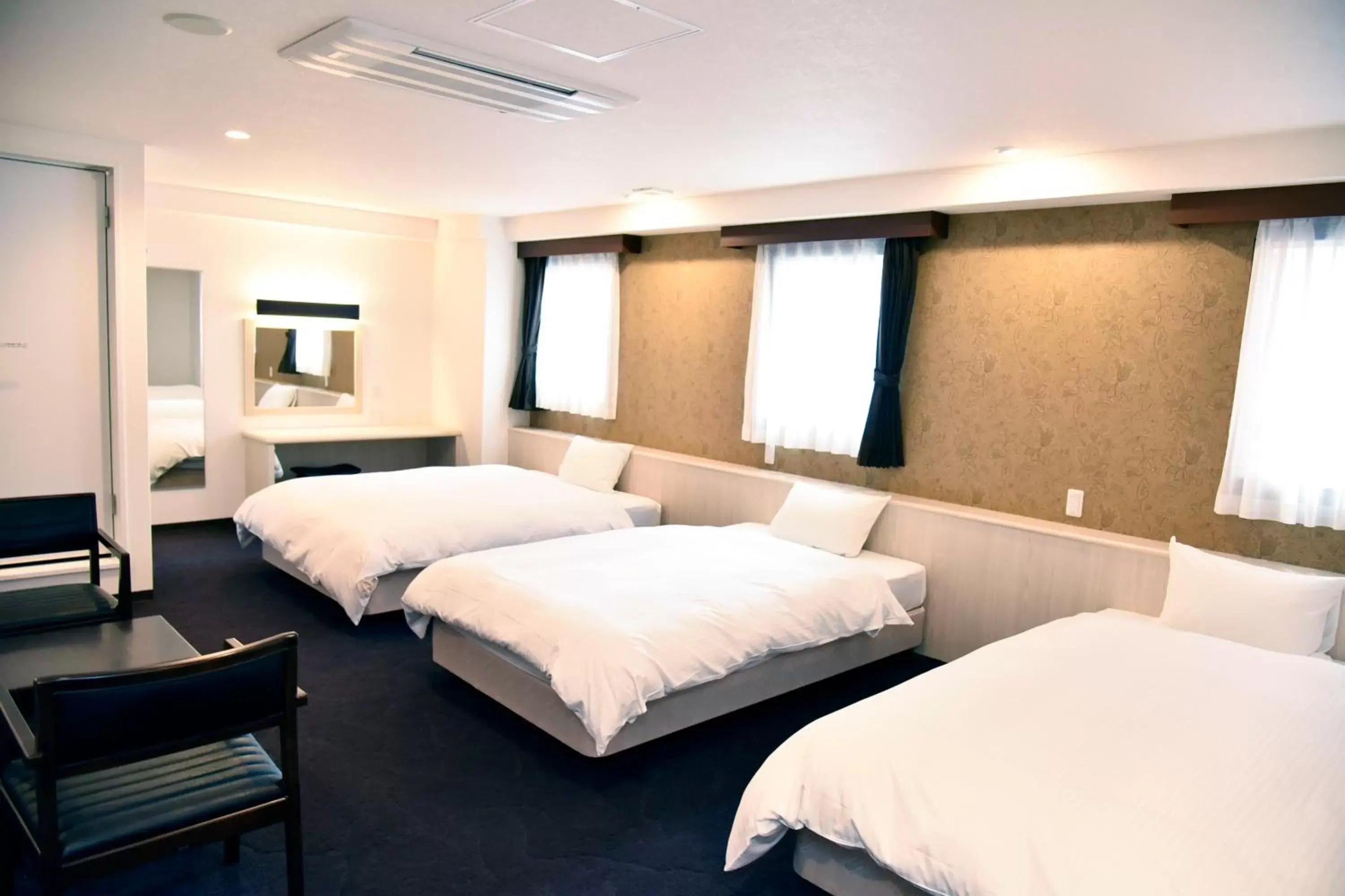 Bed in Miyazaki Daiichi Hotel