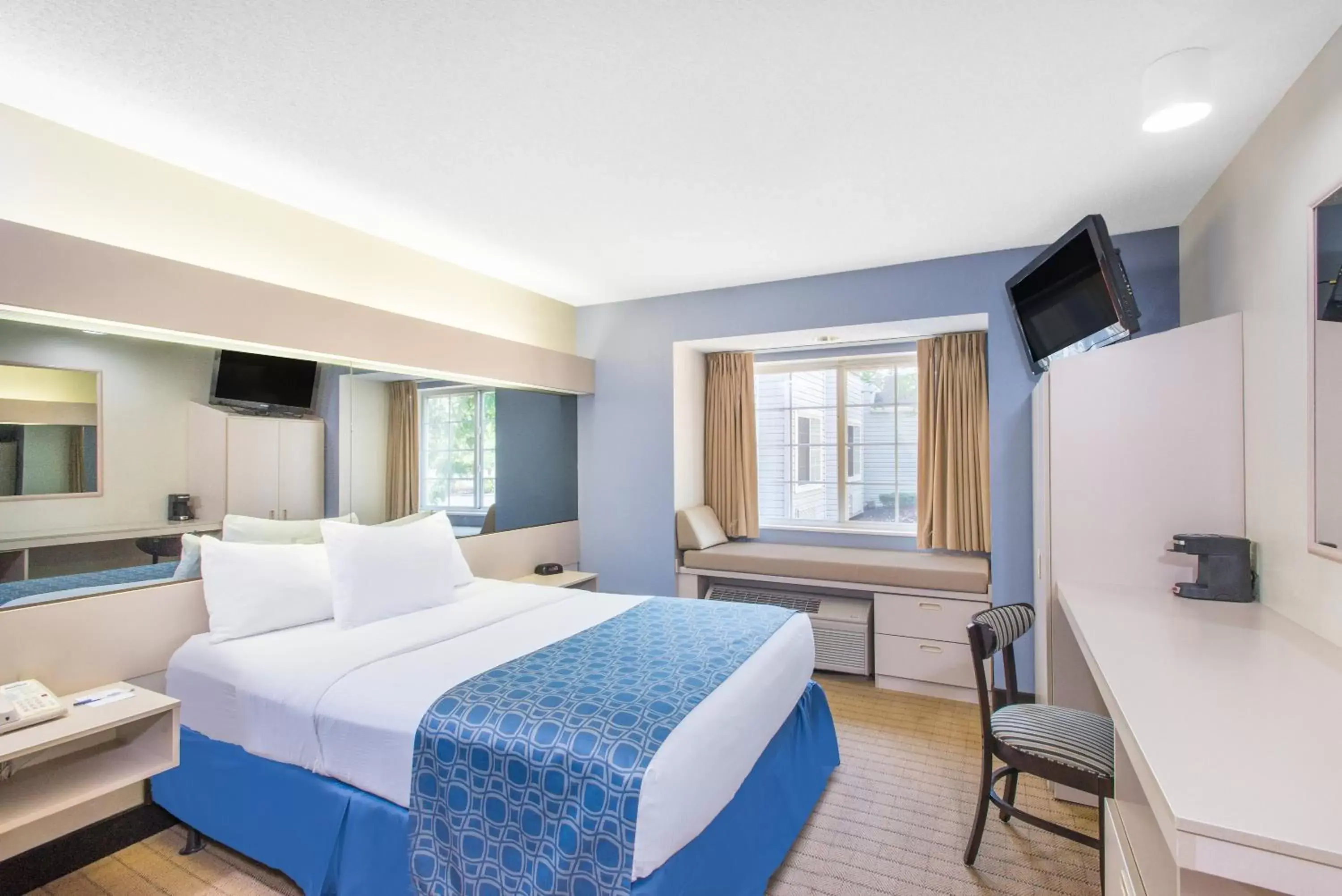 Bed in Microtel Inn & Suites by Wyndham