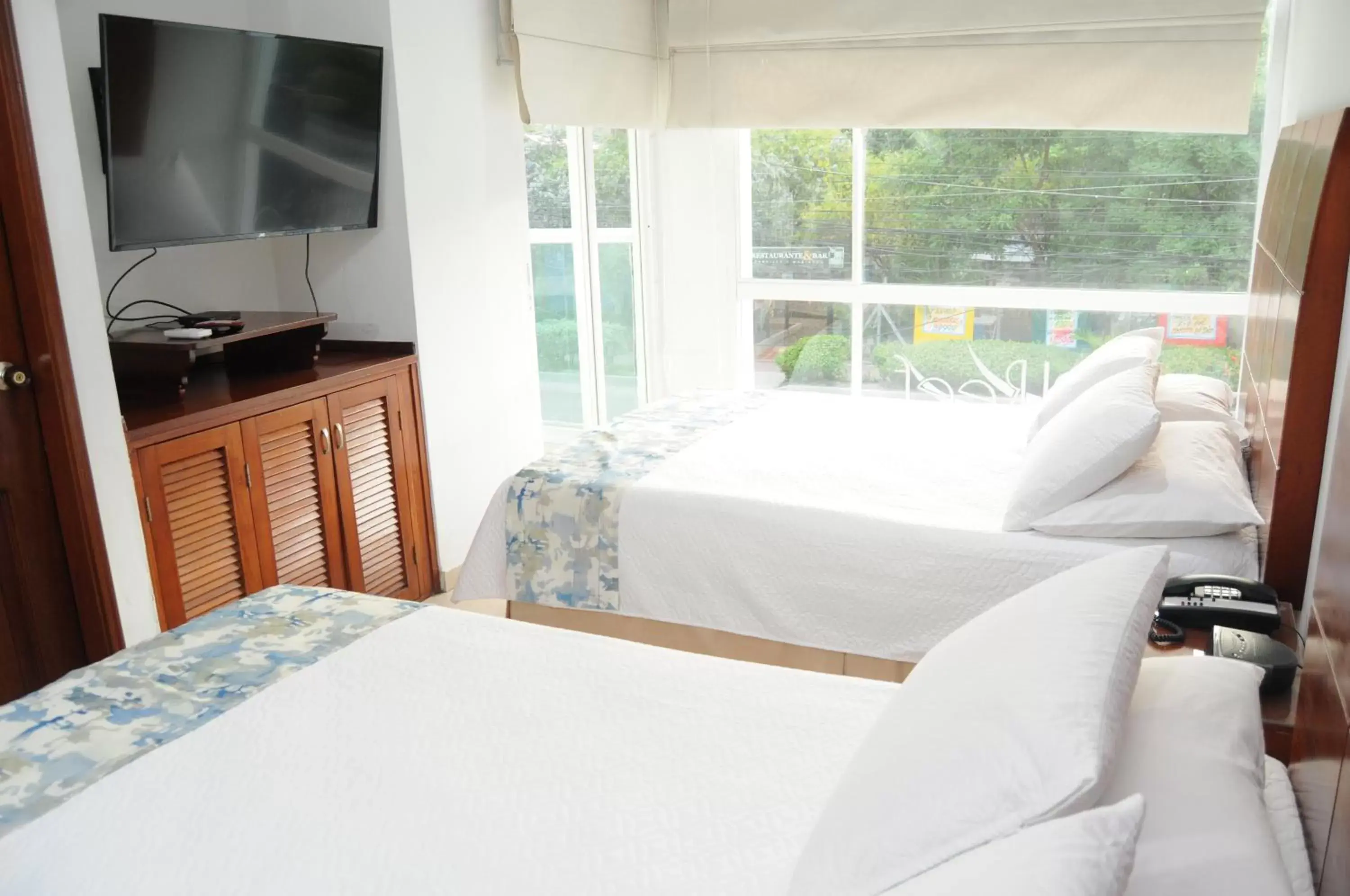 Guests, Bed in Coral Reef Hotel