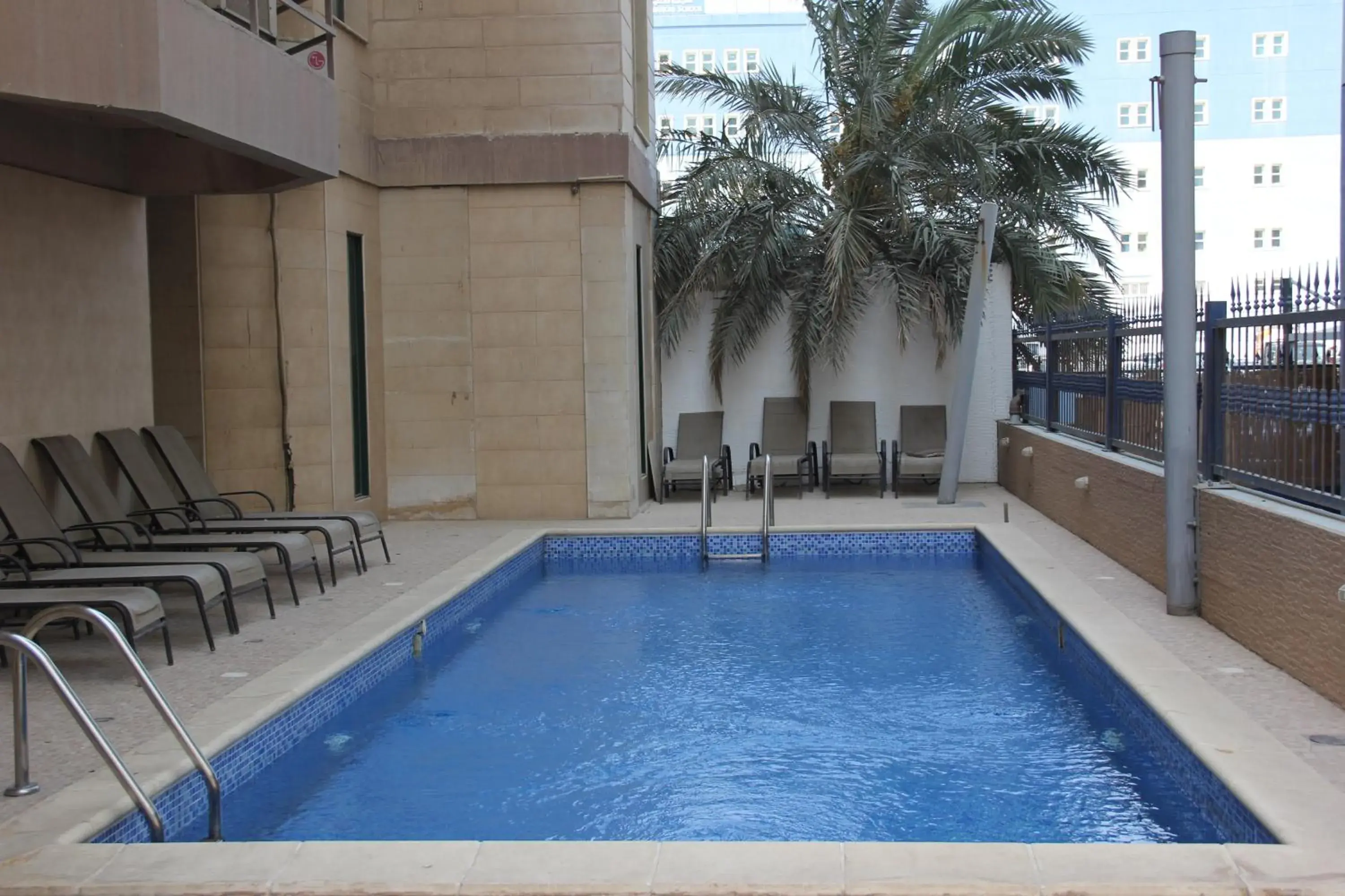 Property building, Swimming Pool in Times Square Suite Hotel