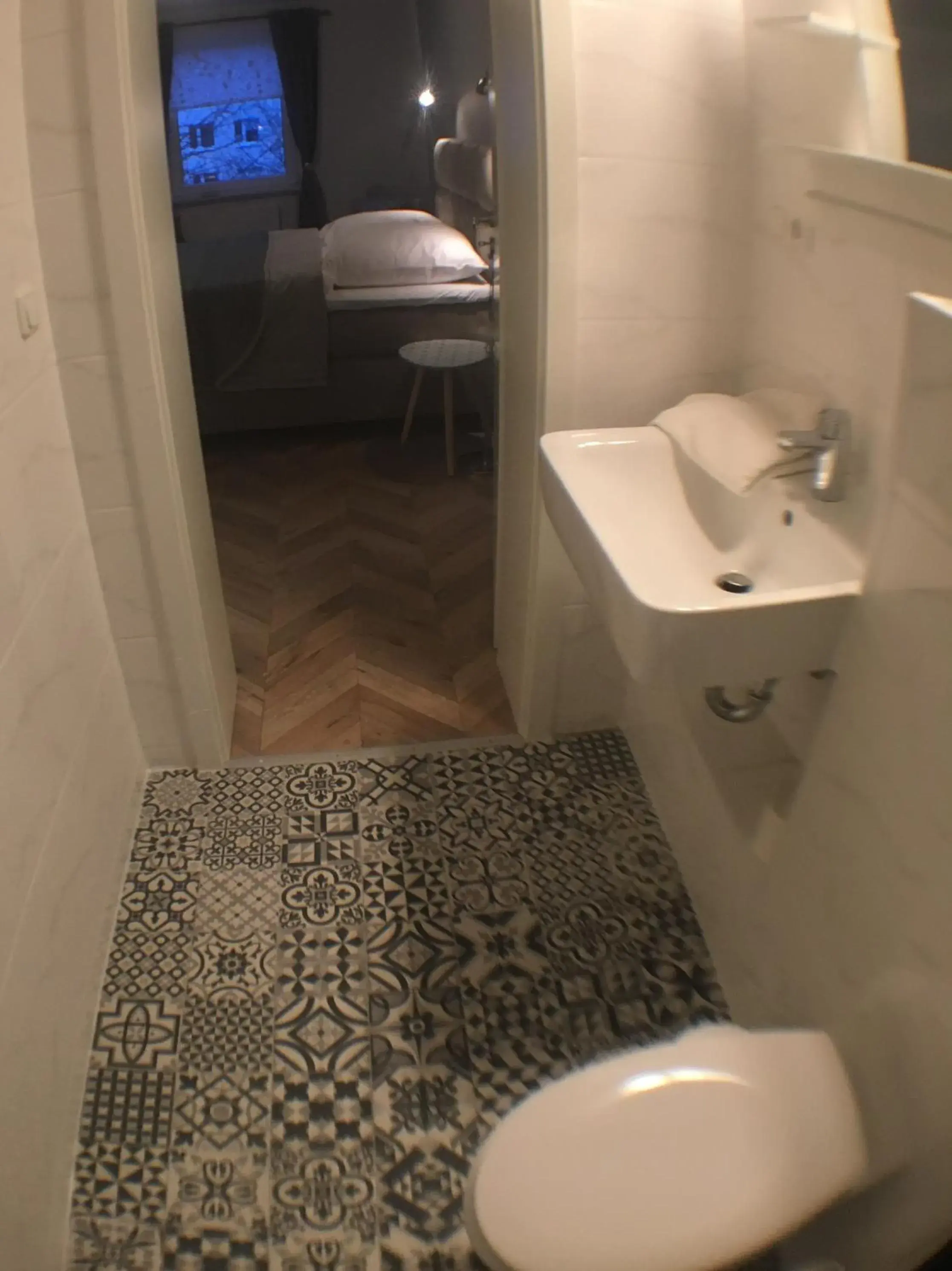Toilet, Bathroom in Tm Suites