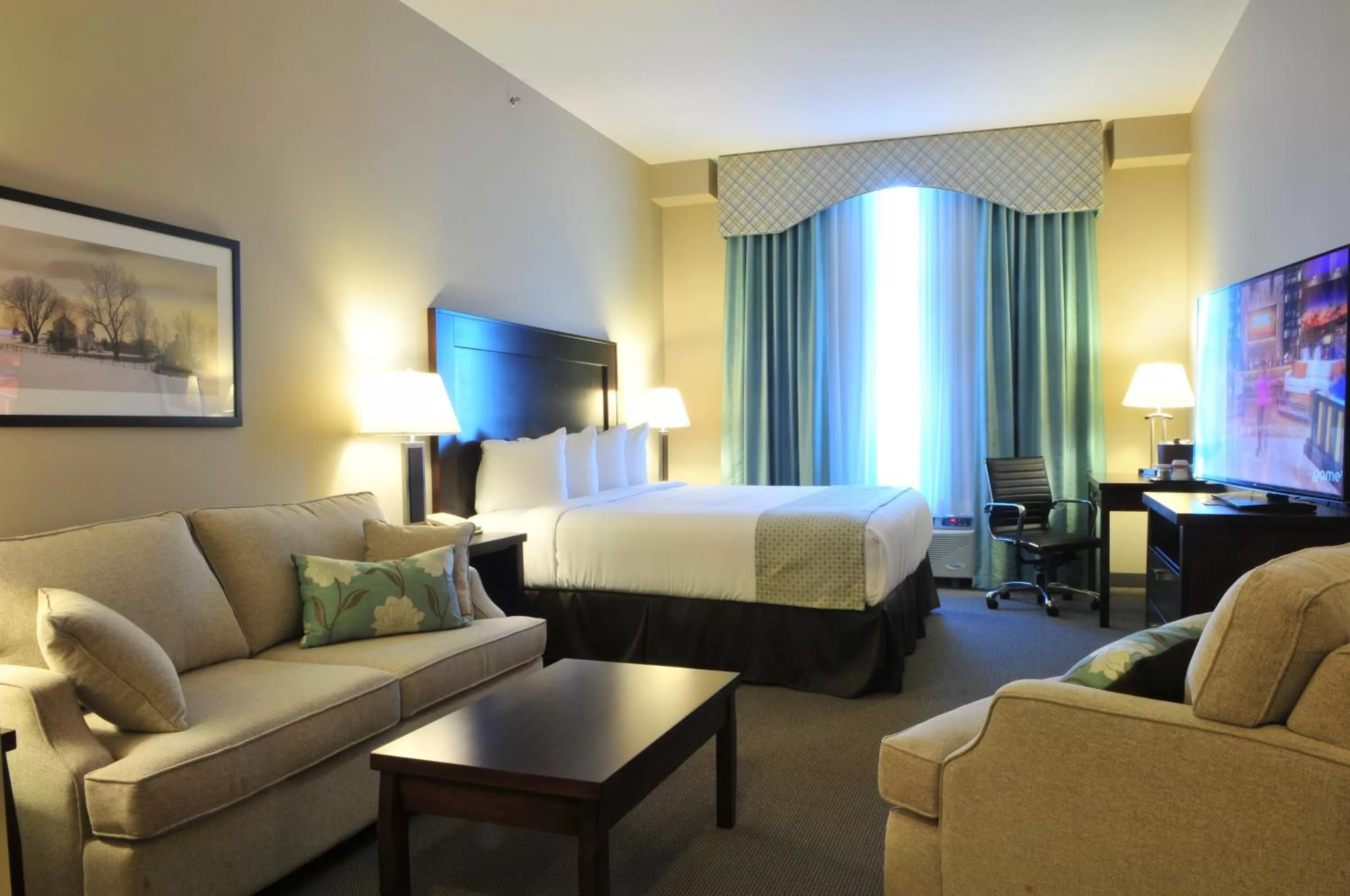 Photo of the whole room, Bed in Ramada by Wyndham Emerald Park/Regina East