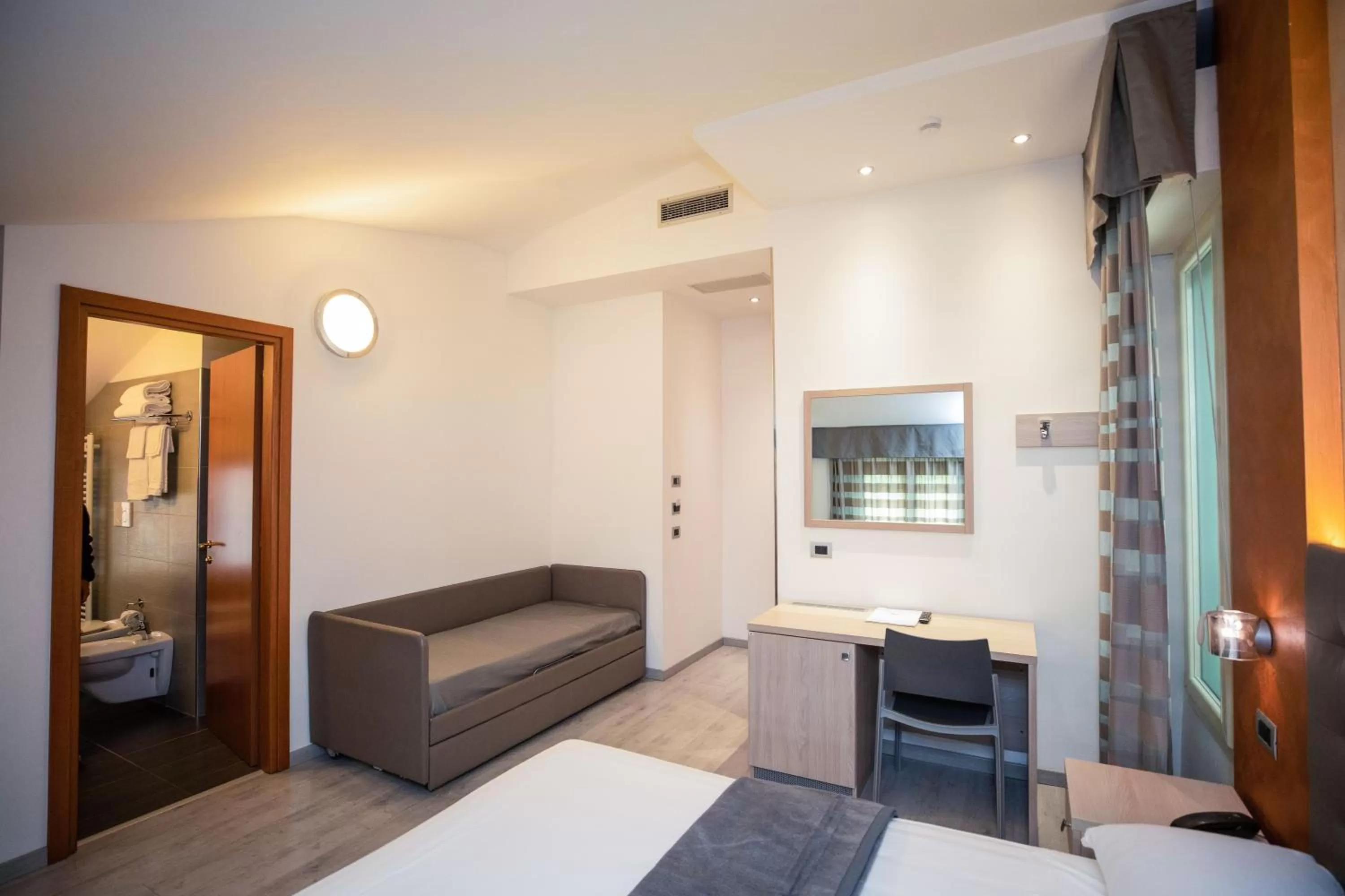 Seating area, Bed in Hotel Gabbiano