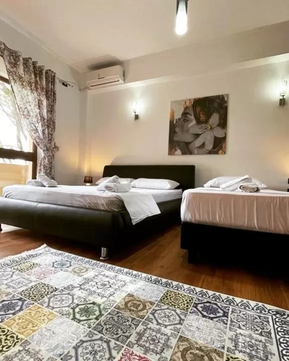 Bed in Hotel Ambasador Garden