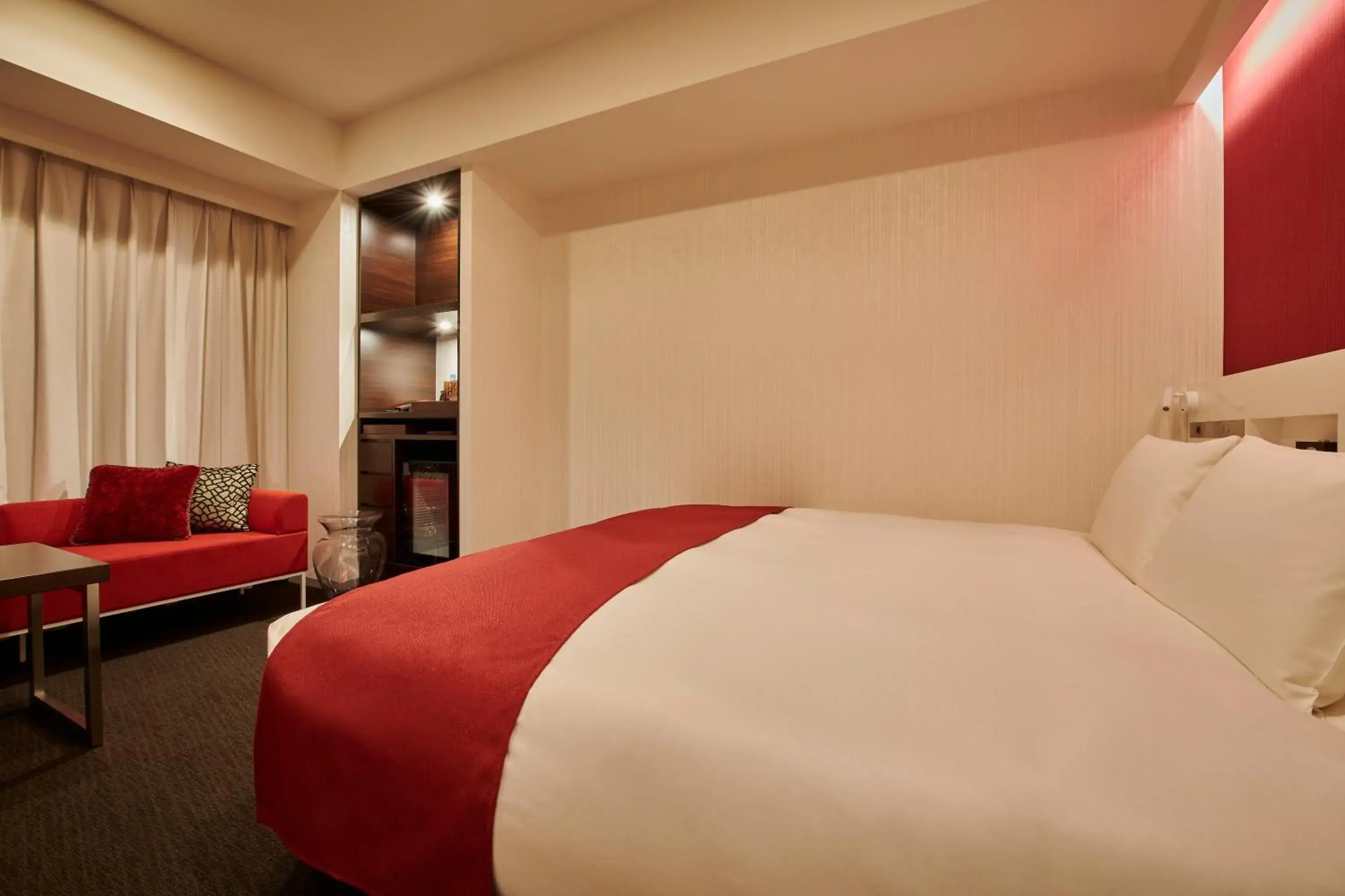 Bed in Cross Hotel Sapporo