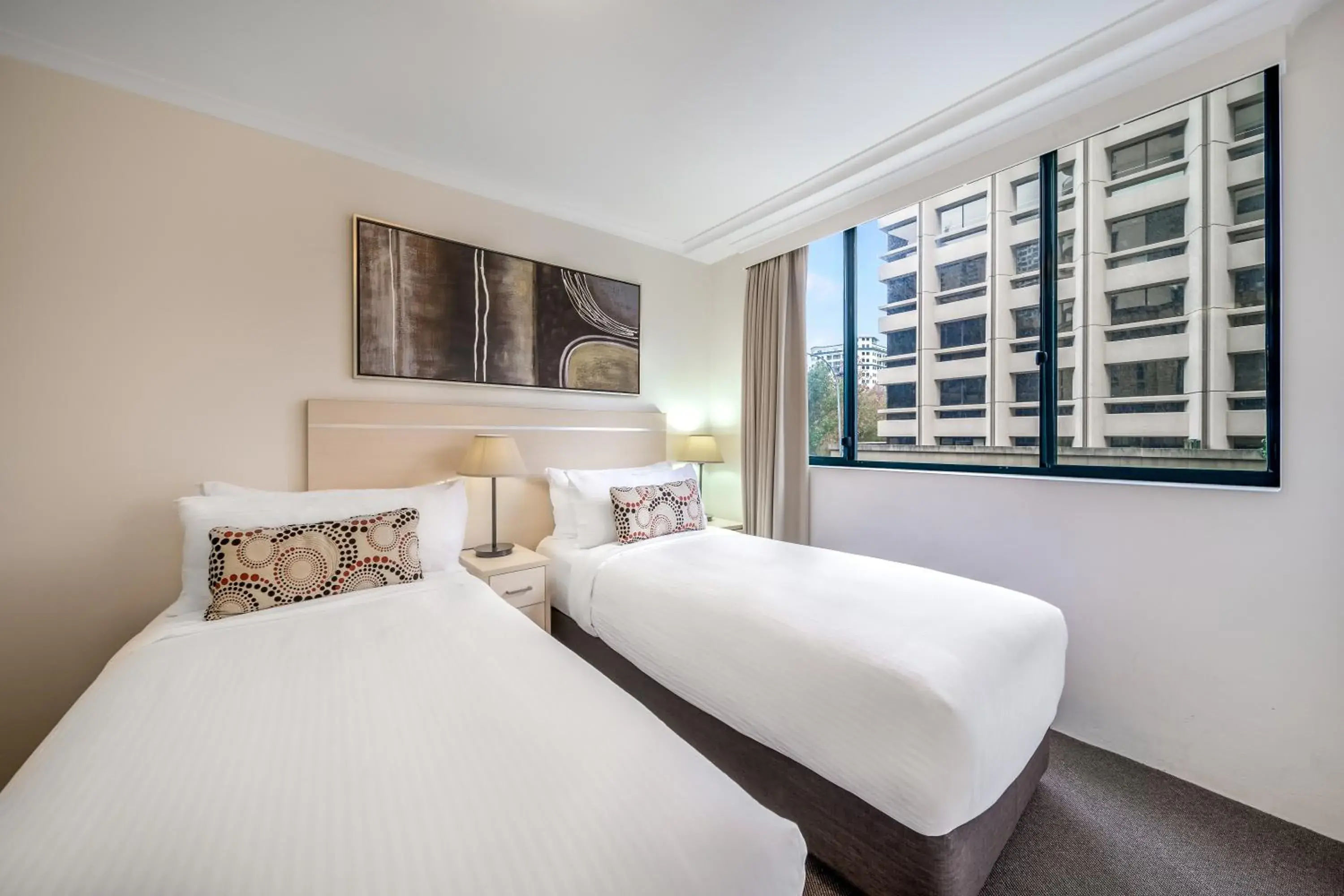 Bed in Oaks Sydney Castlereagh Suites