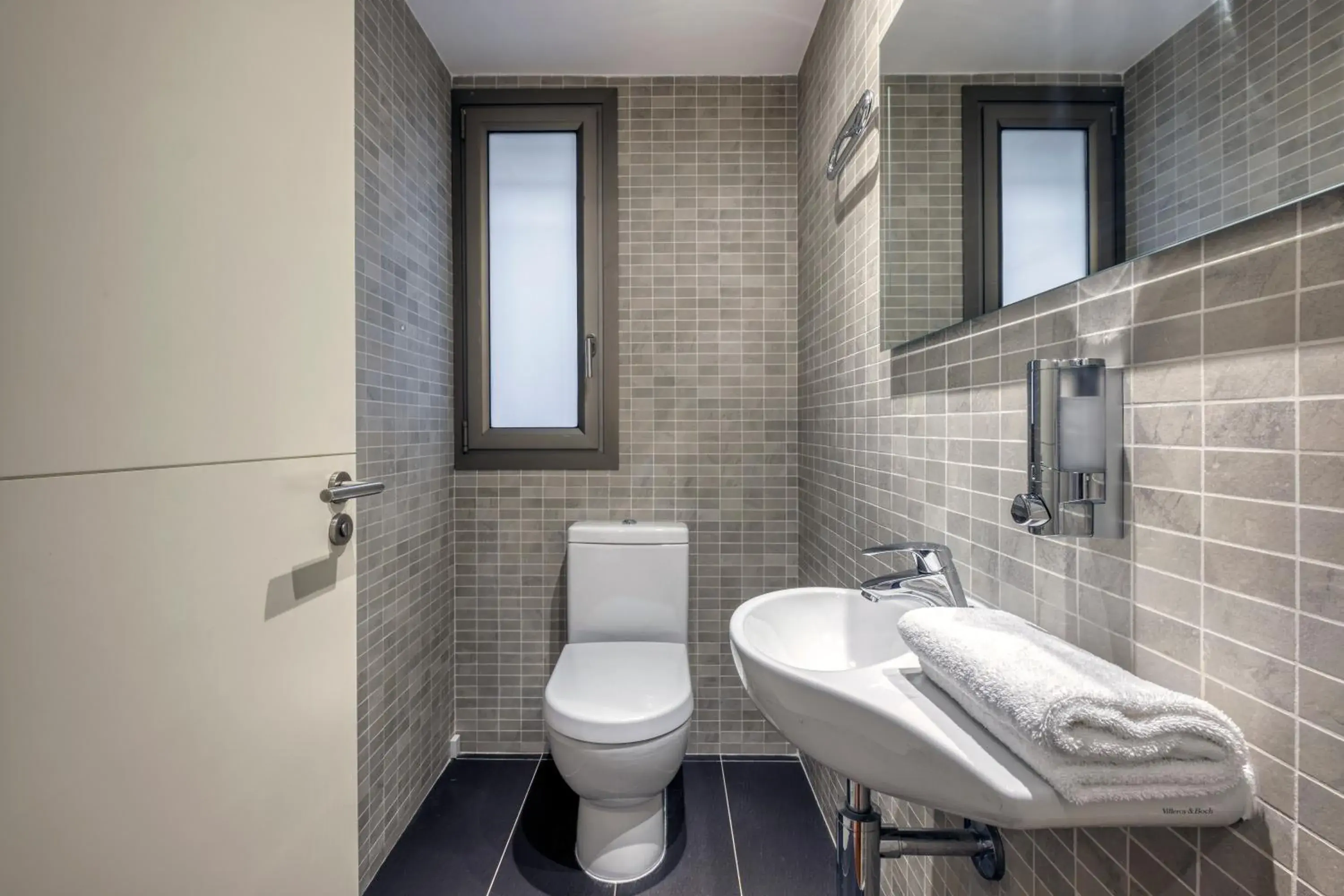 Toilet, Bathroom in Paseo de Gracia Bas Apartments by Aspasios