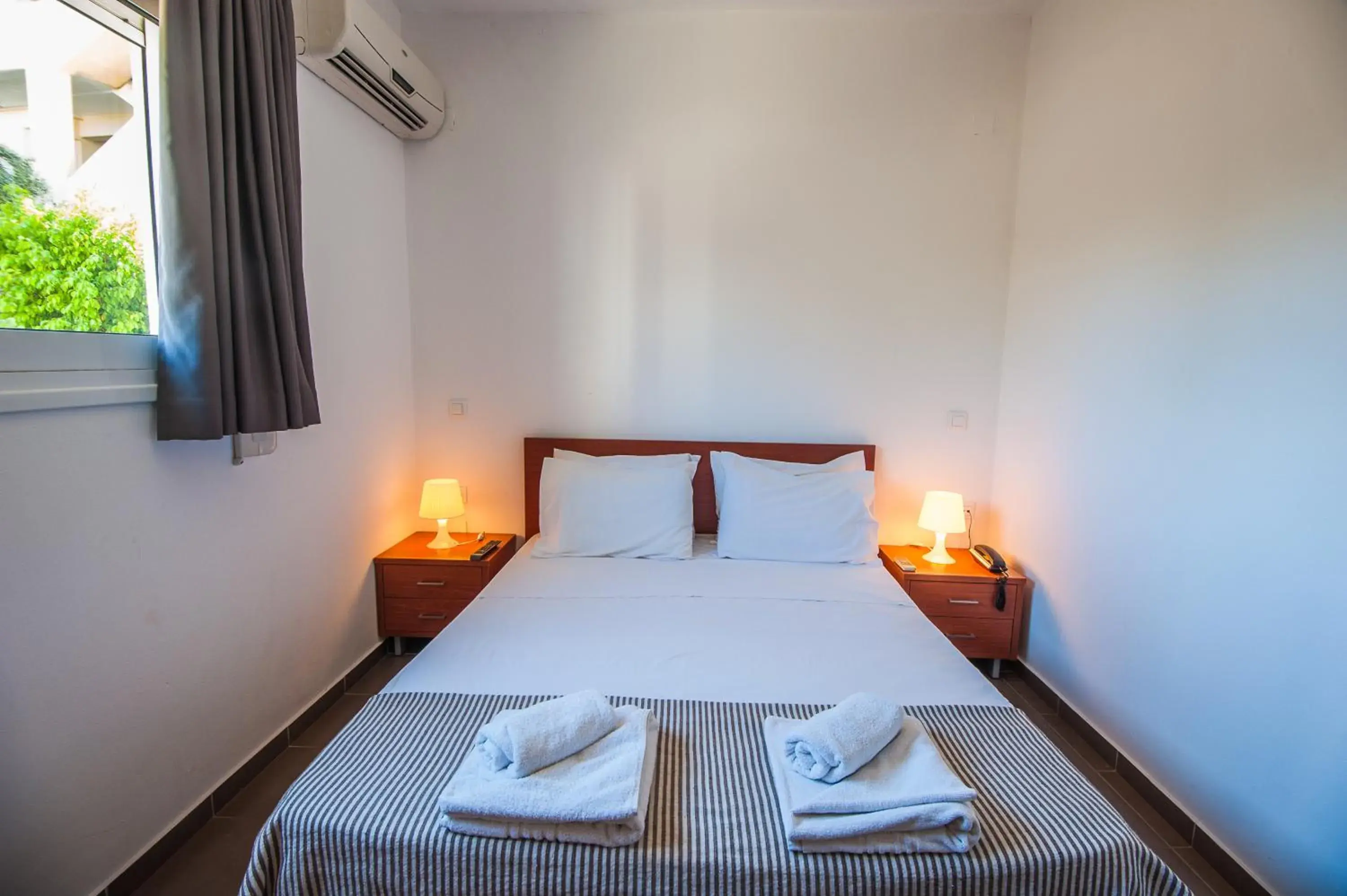 Bed in Elounda Sunrise Apartments