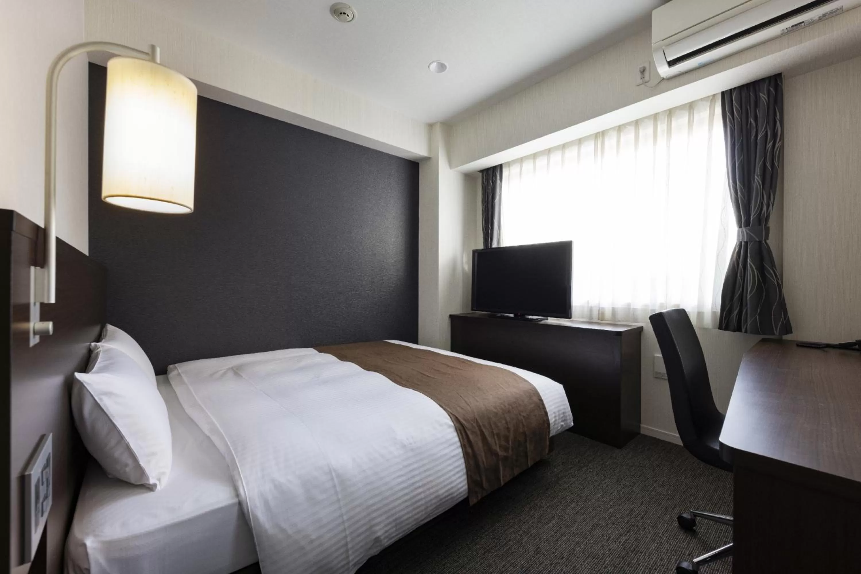 Photo of the whole room, Bed in KOKO HOTEL Osaka Shinsekai - formerly Hotel Wing Premium Osaka Shinsekai