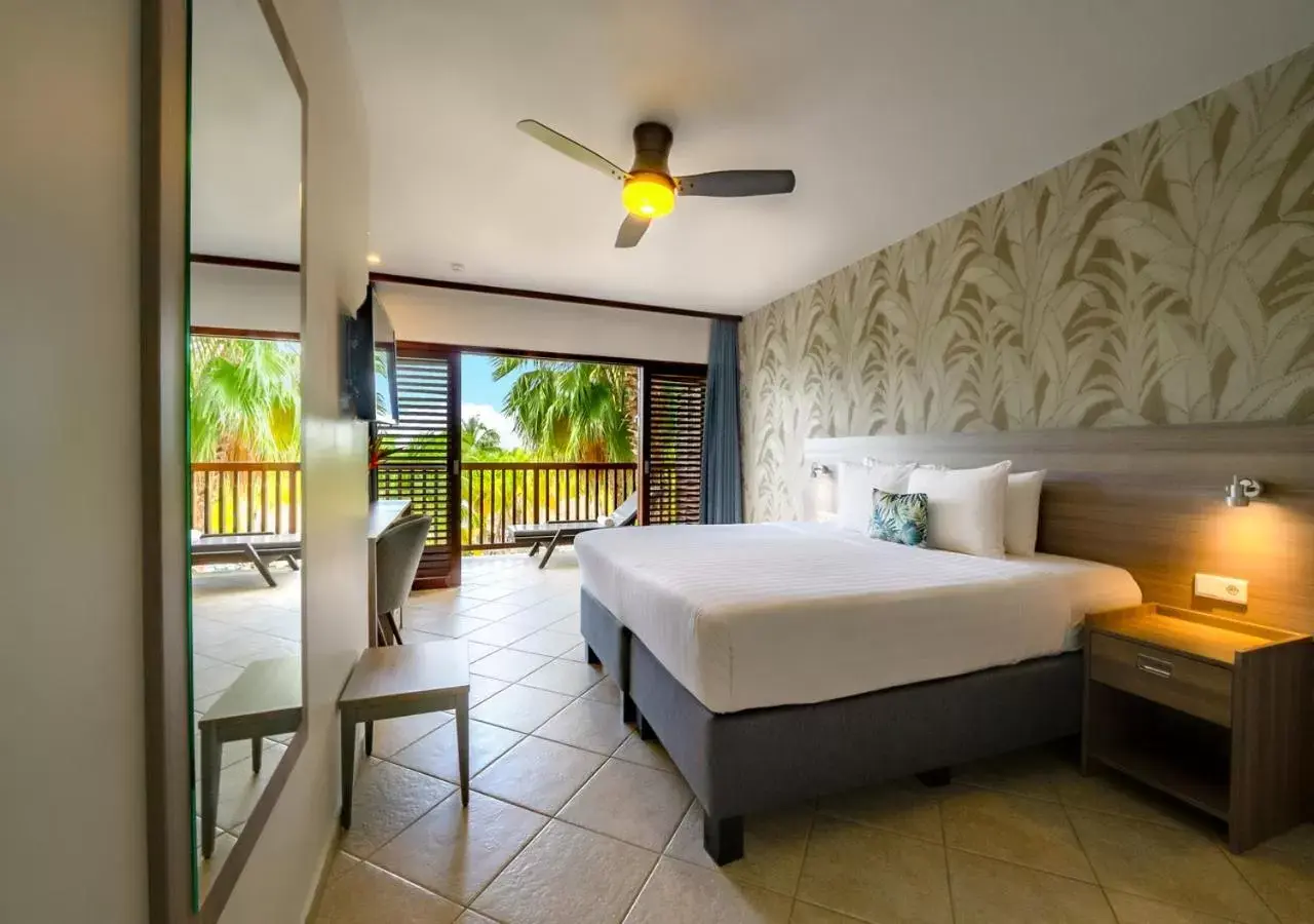 Bed in LionsDive Beach Resort