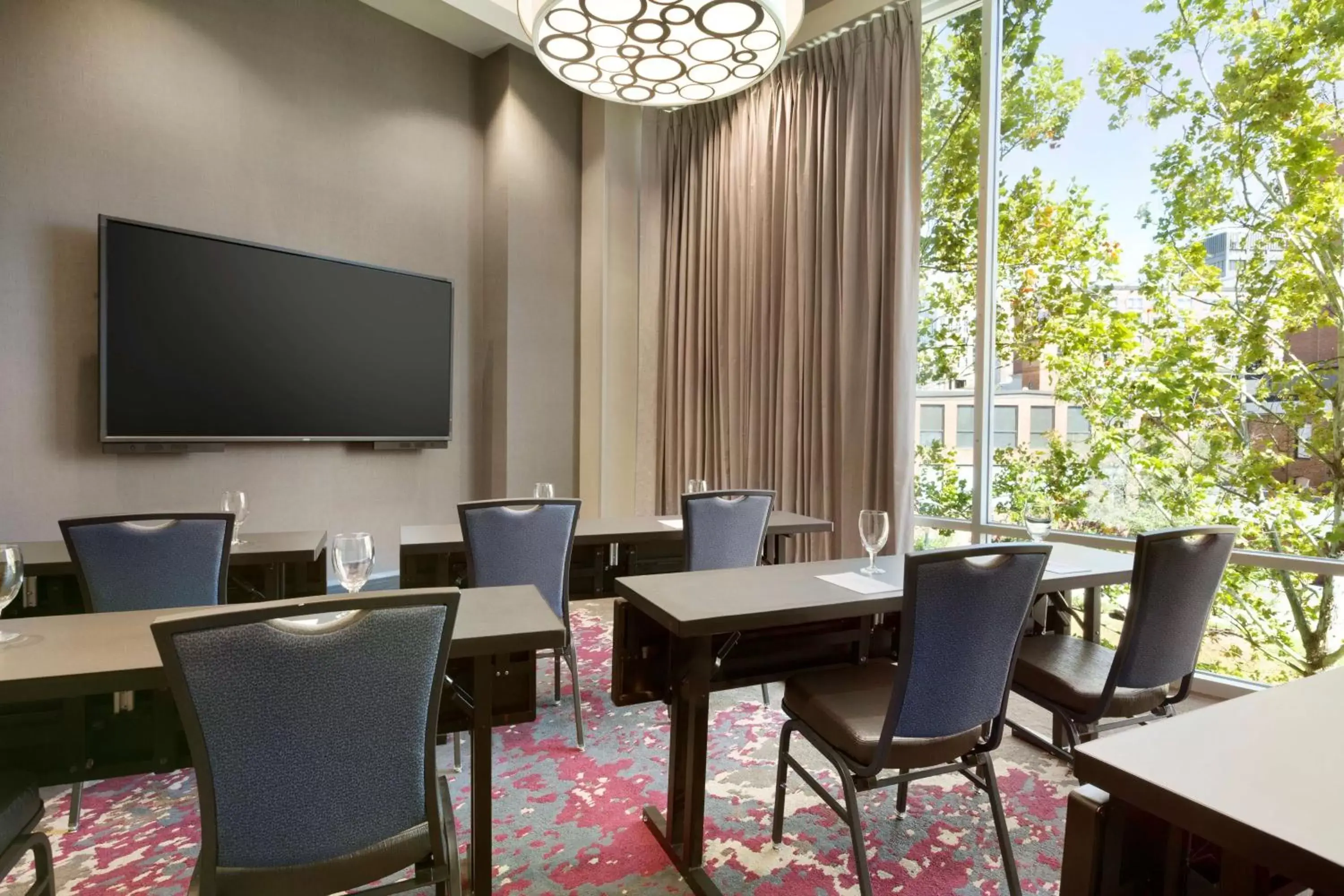 Meeting/conference room, TV/Entertainment Center in Embassy Suites by Hilton Greenville Downtown Riverplace