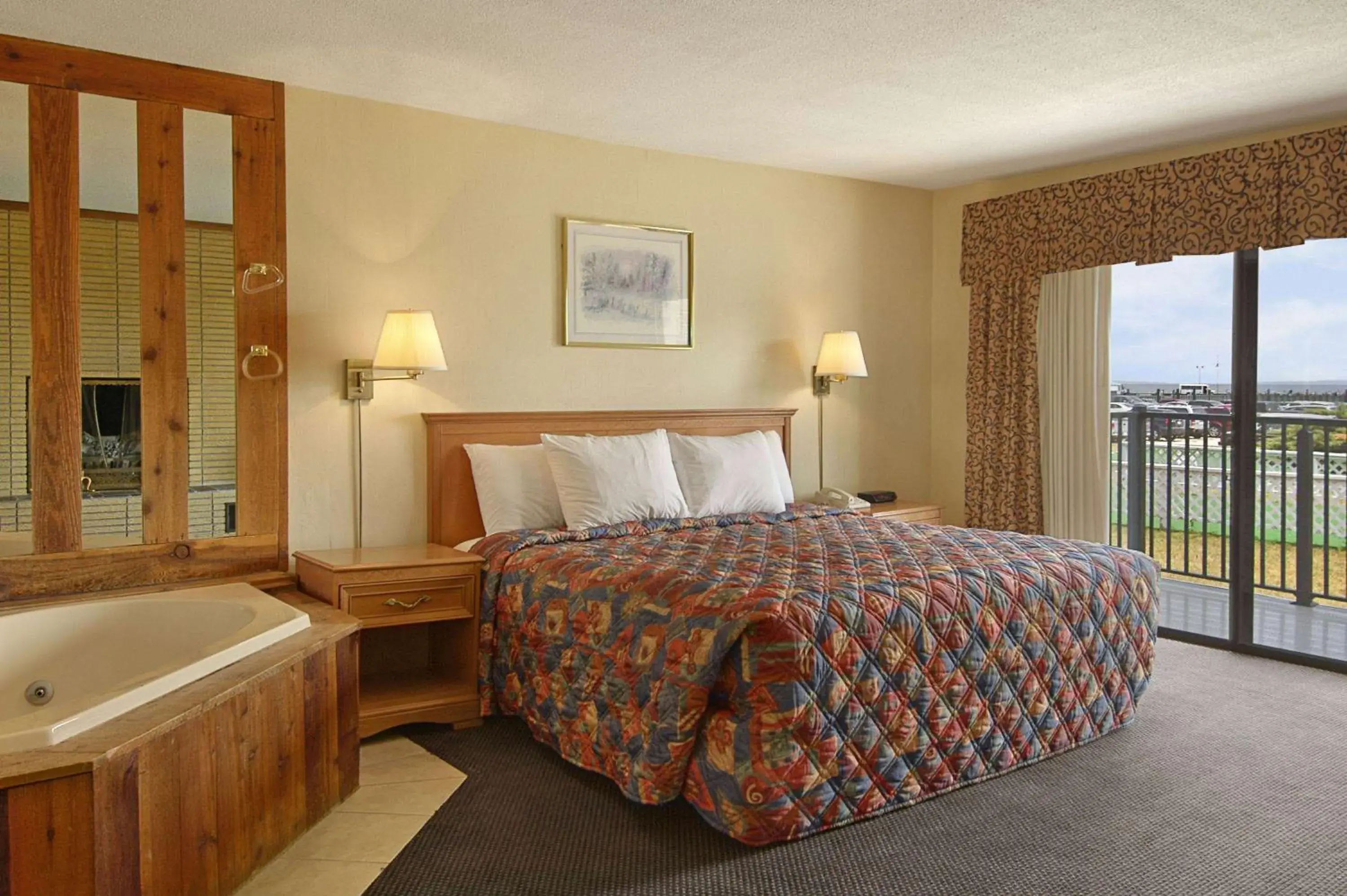 Photo of the whole room, Bed in Days Inn by Wyndham Mackinaw City - Lakeview