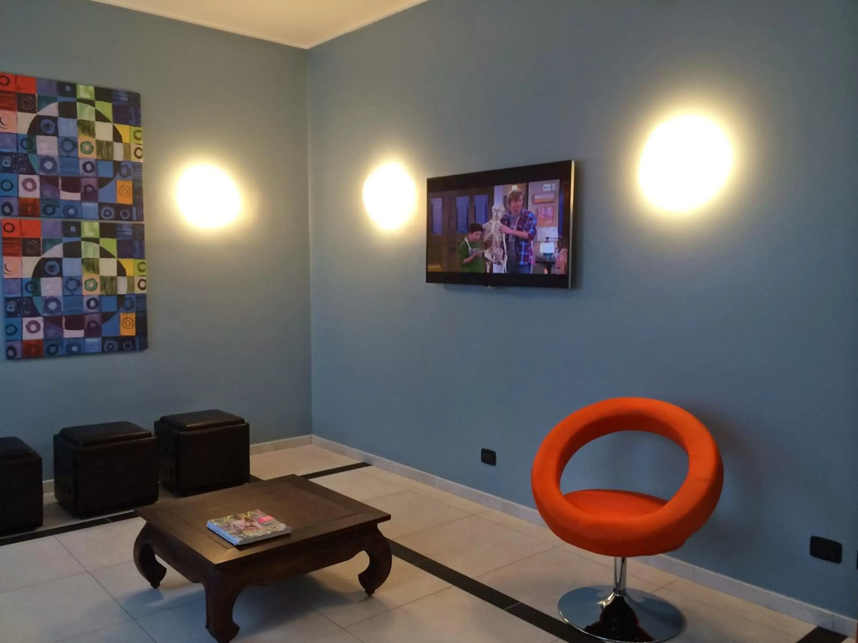 Communal lounge/ TV room, Seating Area in Hotel Arcobaleno