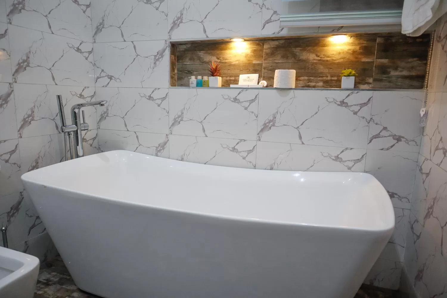 Shower in God's Touch Apartments Signature