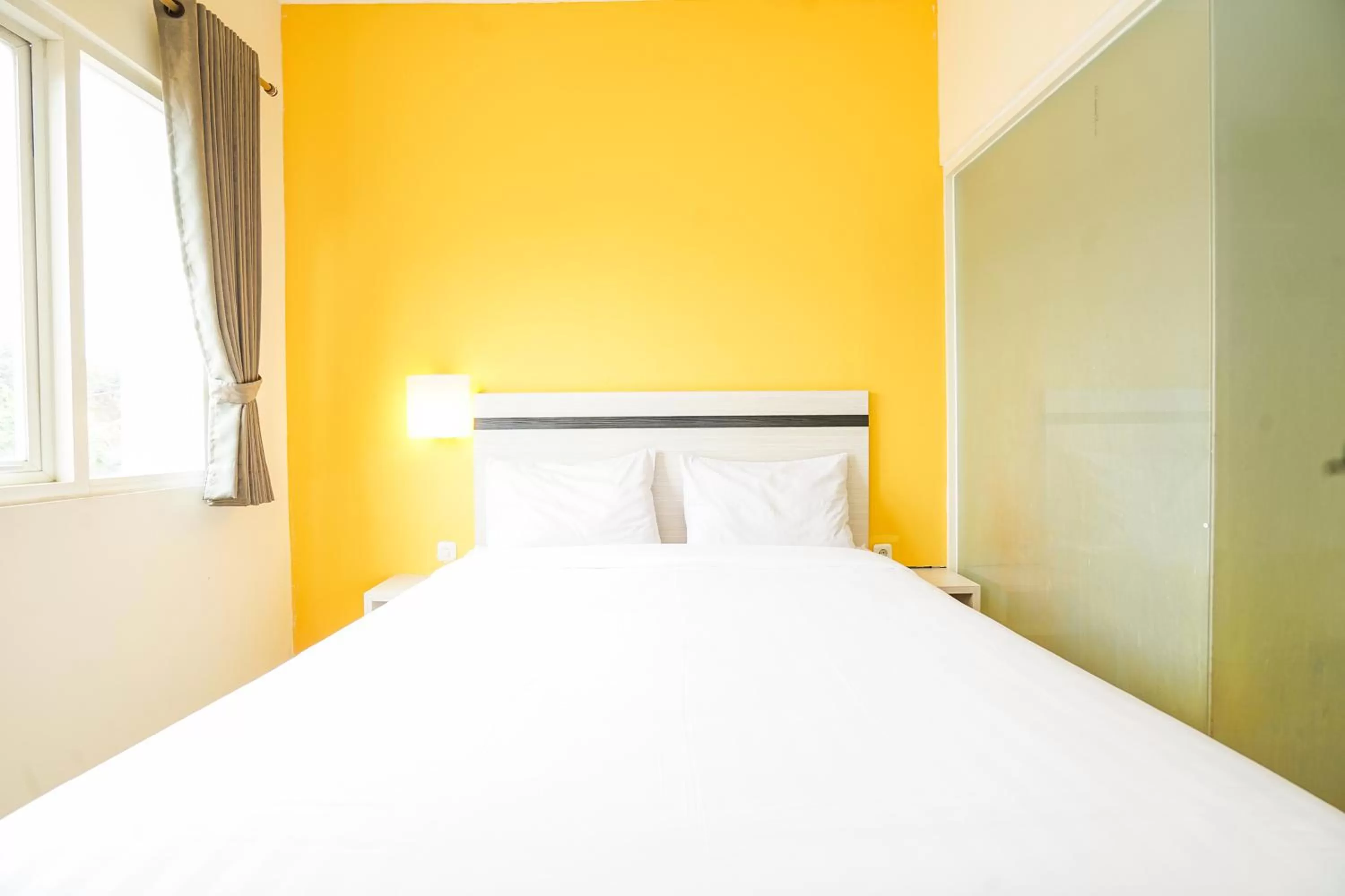 Bed in Pratisarawirya Guesthouse by ecommerceloka