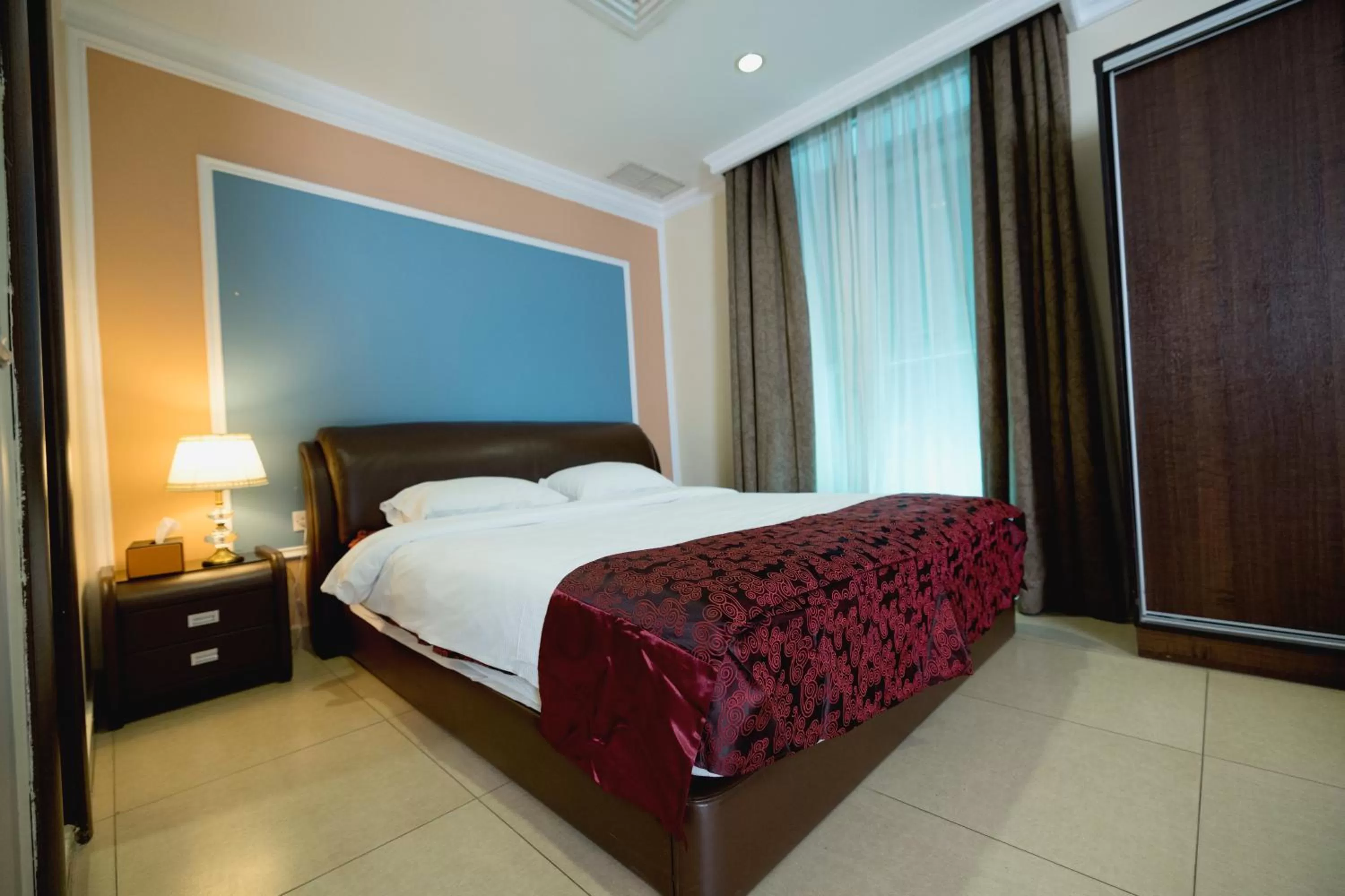 Bed in Laguna Hotel Suites