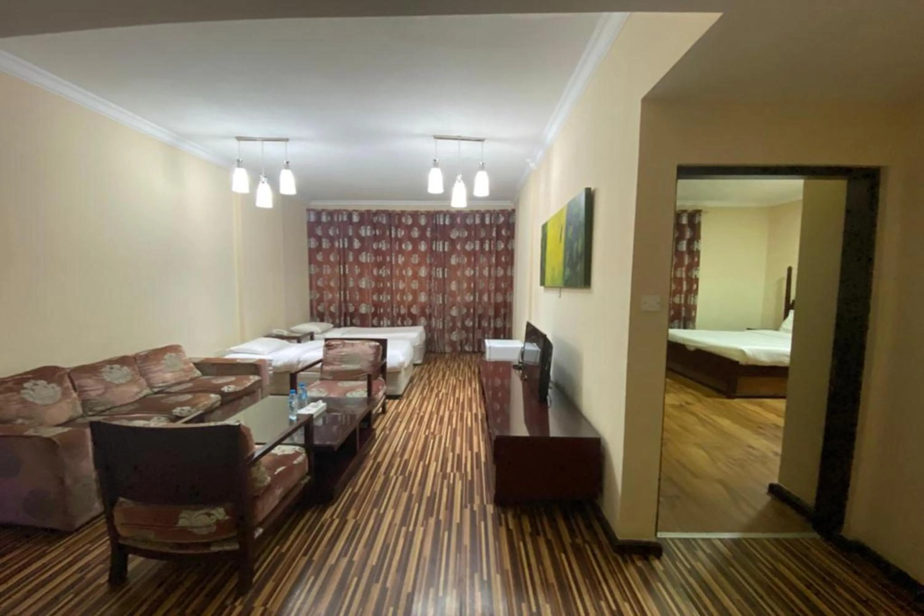 Quadruple Suite with Living Room in Grand PJ Hotel