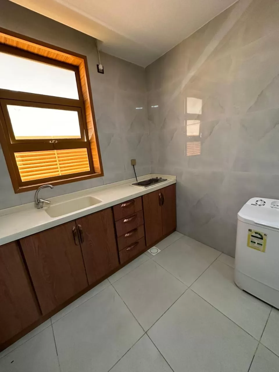 Kitchen or kitchenette in Leen Serviced Apartments-لين للشقق المخدومه