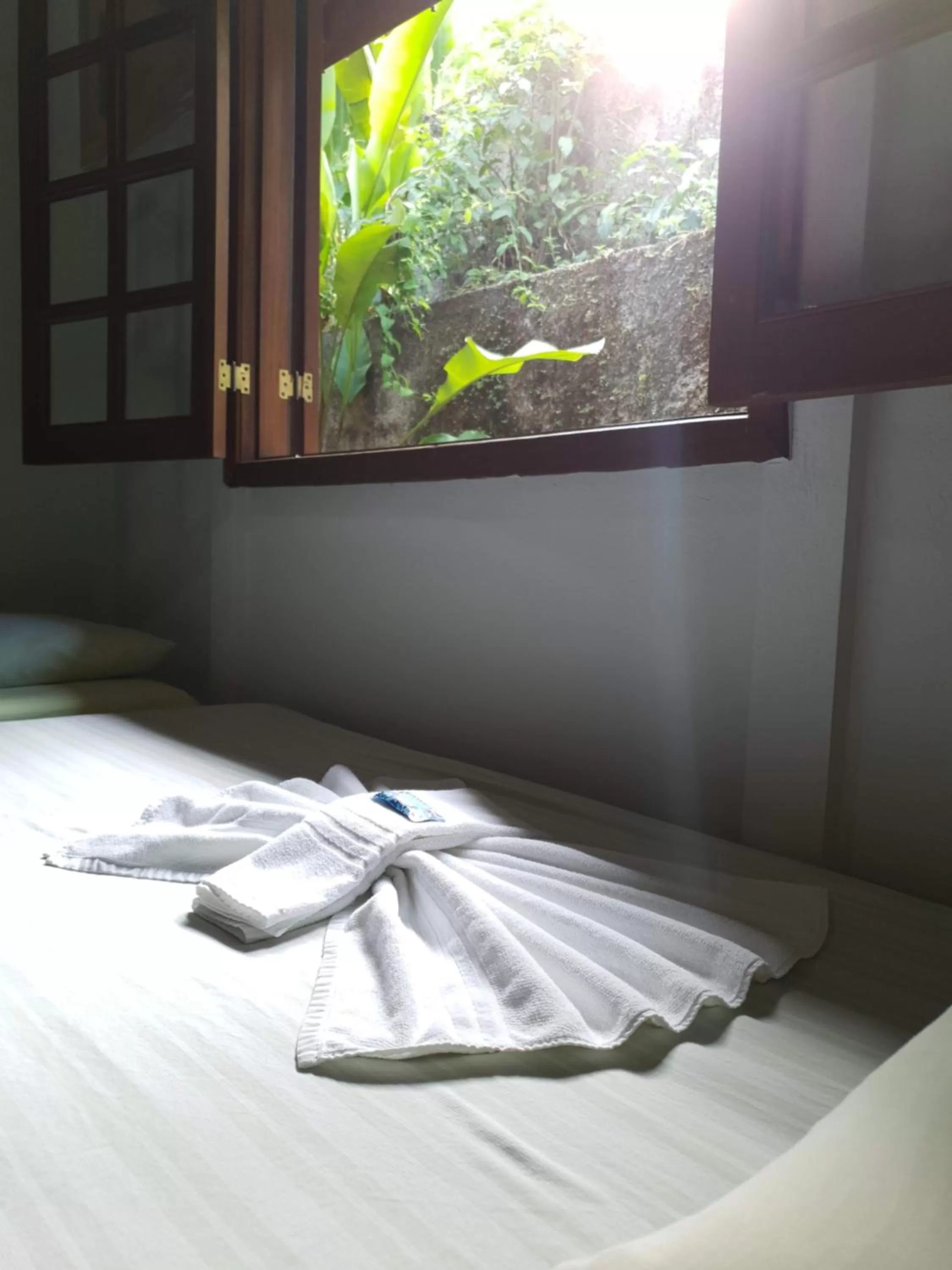 Bed in Pousada Canto do Curió Paraty