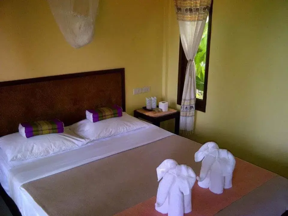 Bed in Paradise Bungalows