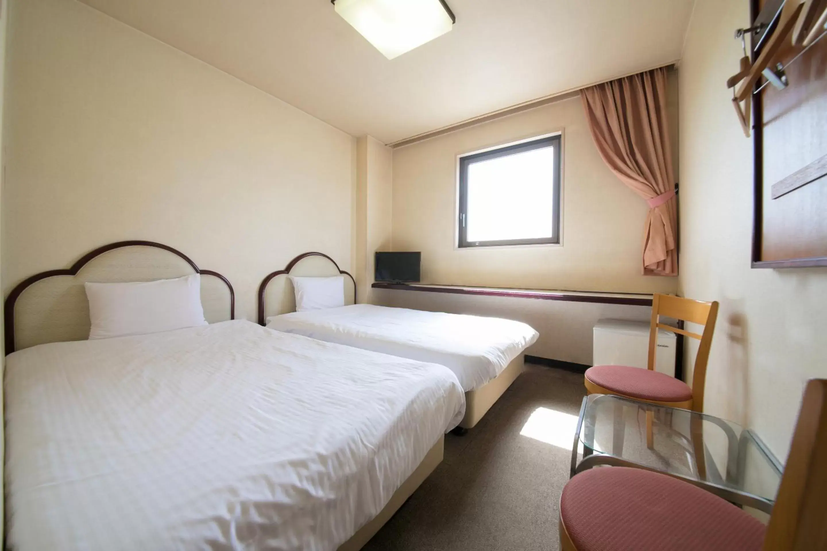 Bed in Heiwadai Hotel Otemon
