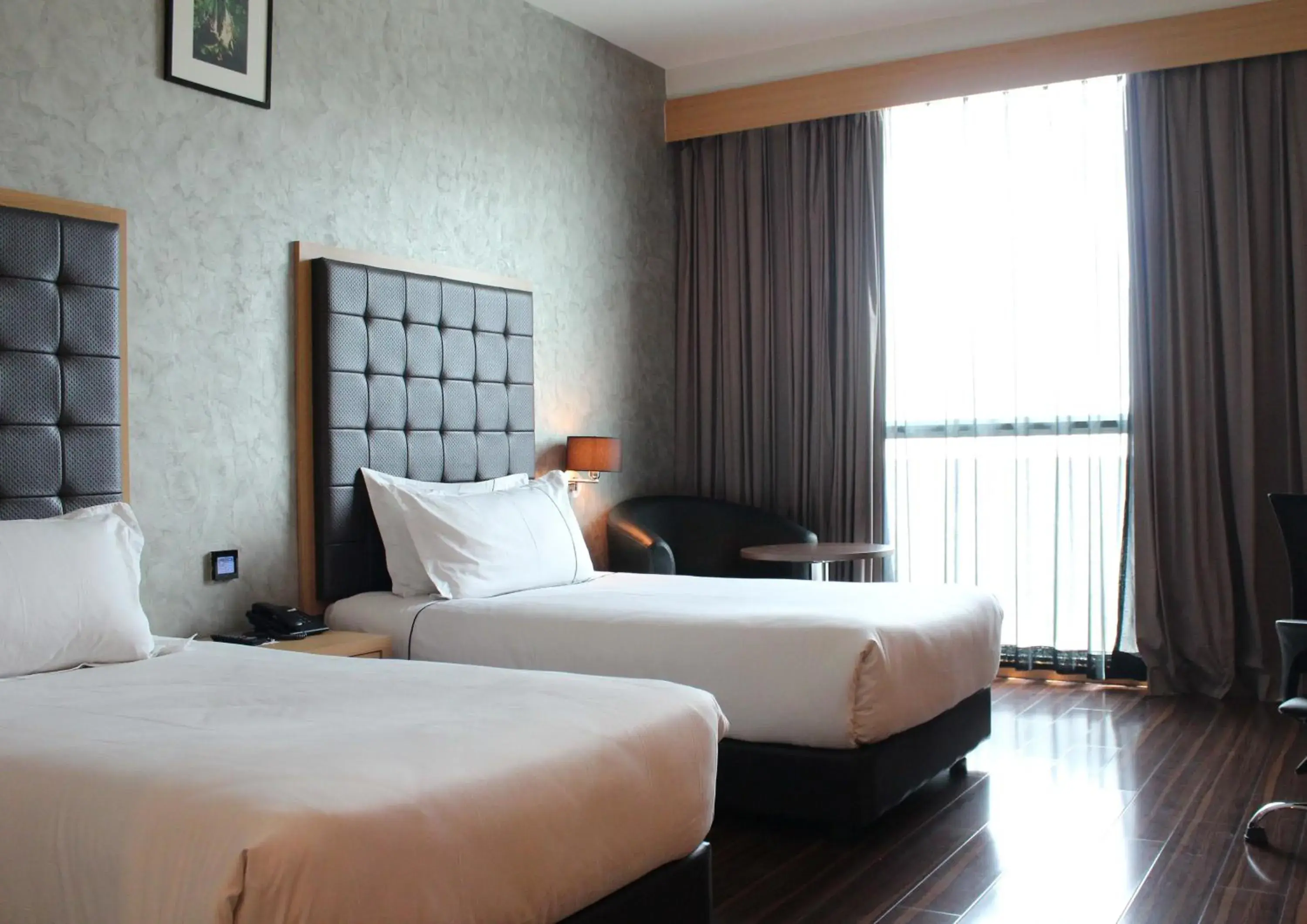 Photo of the whole room, Bed in Symphony Suites Hotel