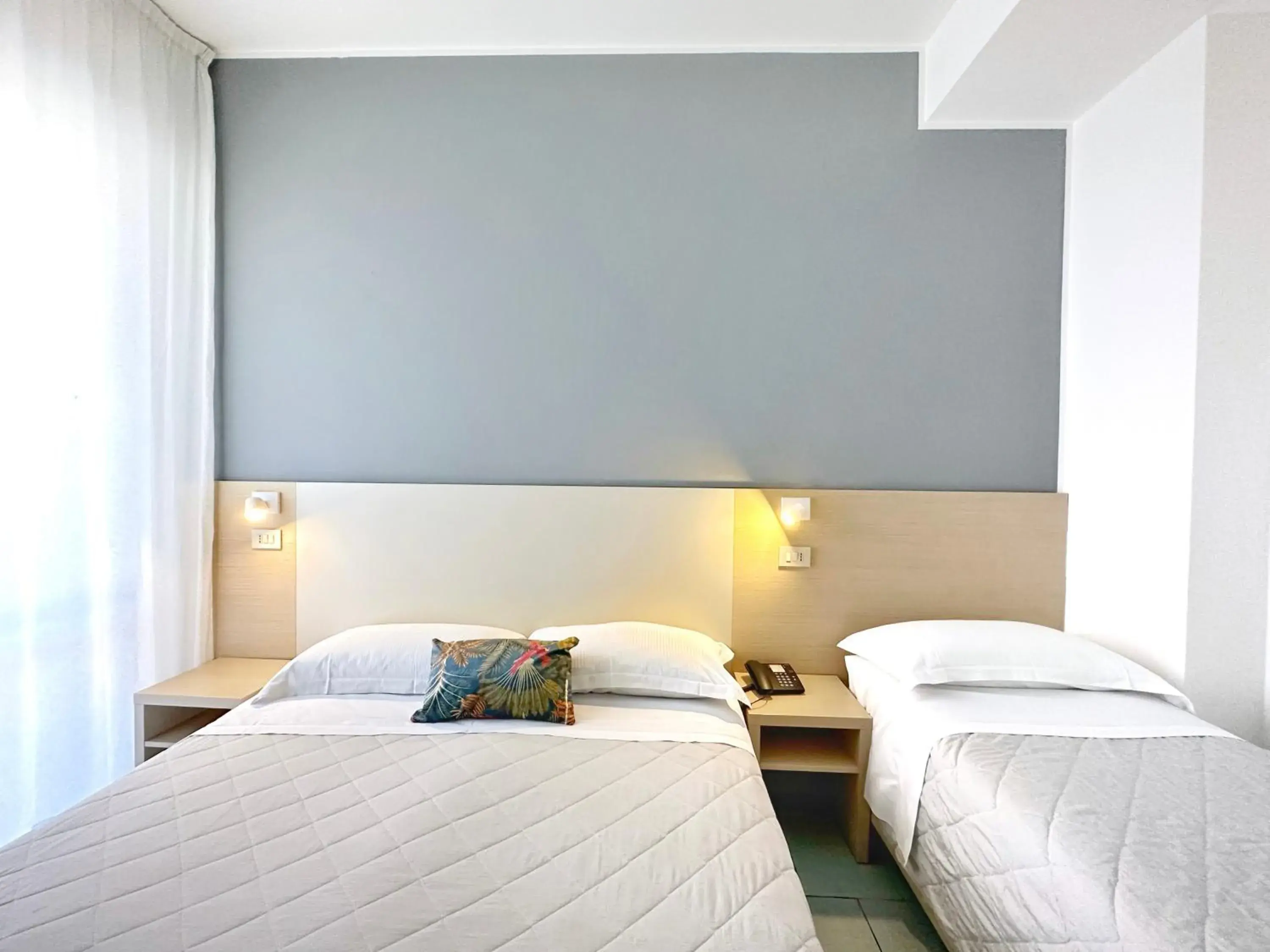 Bed in Aura Living Hotel