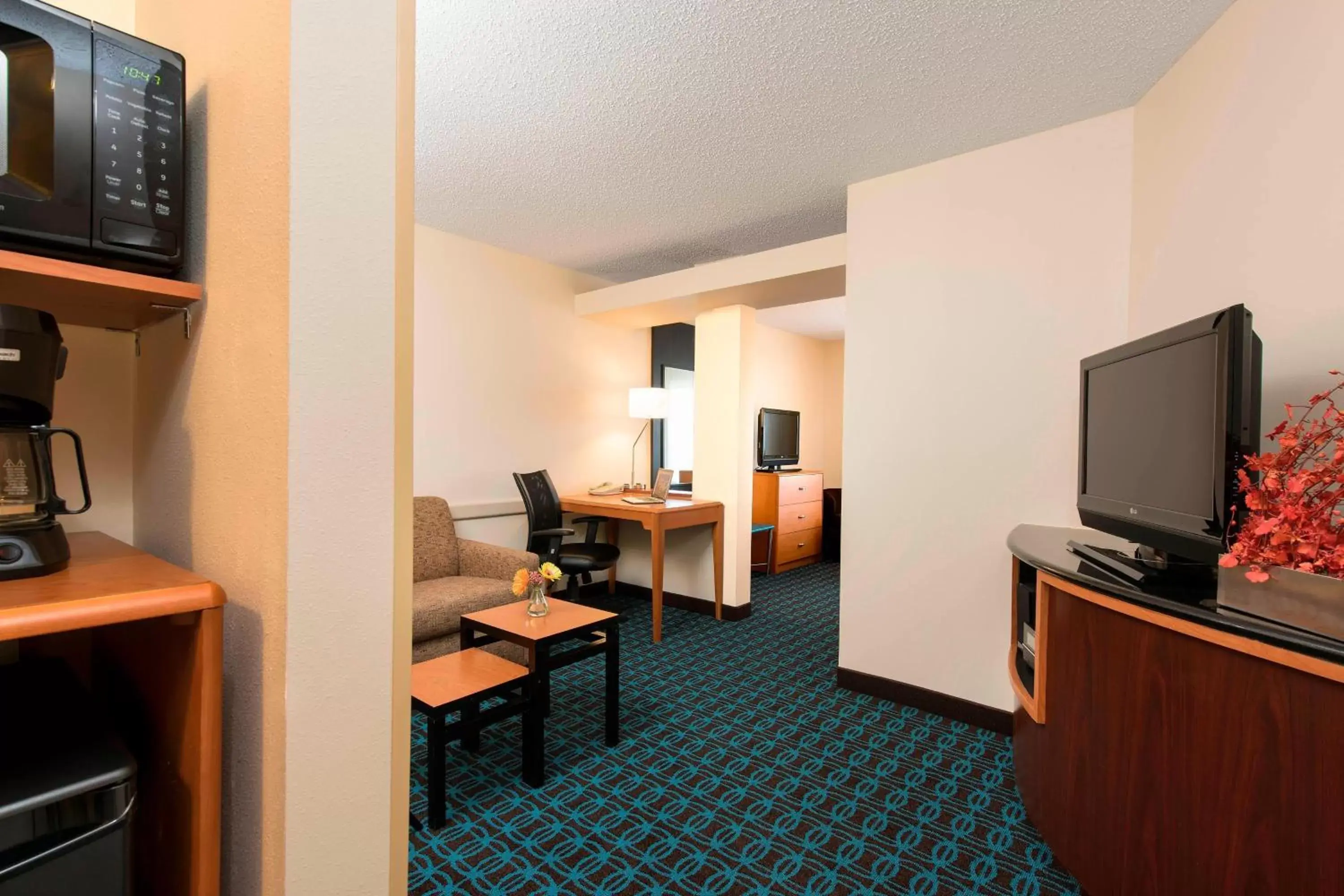Photo of the whole room, TV/Entertainment Center in Fairfield Inn & Suites by Marriott Bloomington