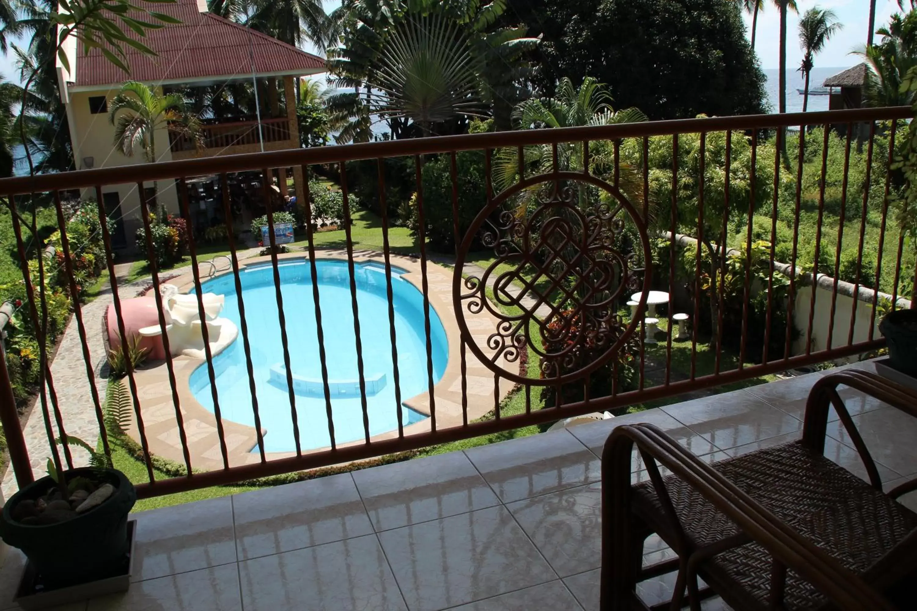 Pool view, Balcony/Terrace in Wellbeach Dive Resort