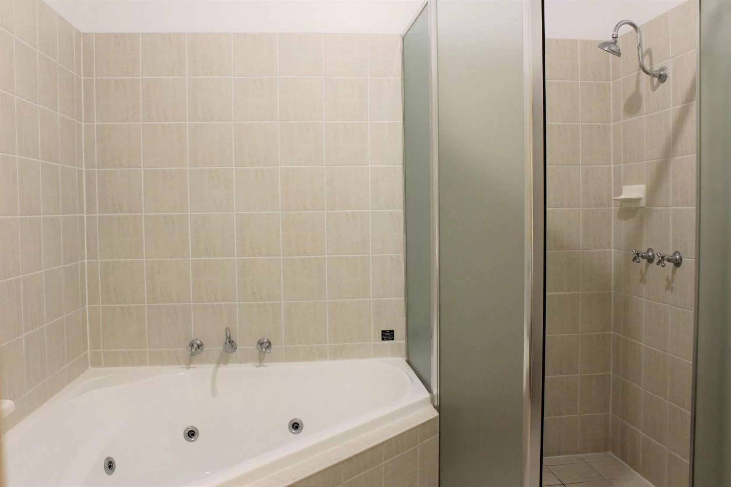 Bathroom in Carlyle Suites & Apartments