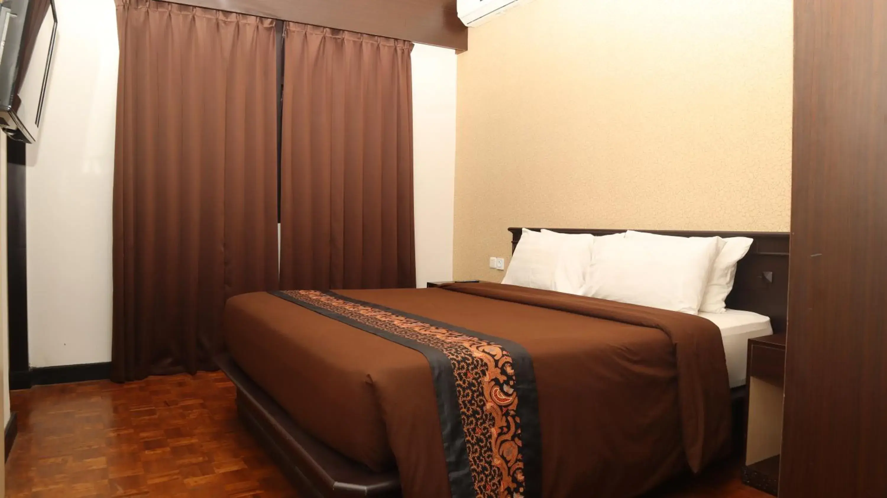 Bed in Kusuma Agrowisata Resort & Convention